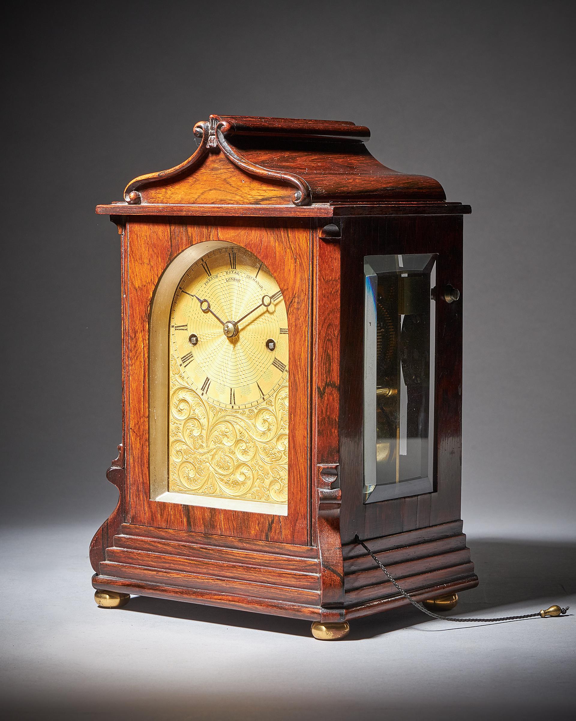 This lovely small library clock has a spring-driven eight-day twin chain-fusee movement with going and striking trains. The going train has anchor escapement with a short pendulum and stirrup regulation to facilitate adjusting the timing, which is