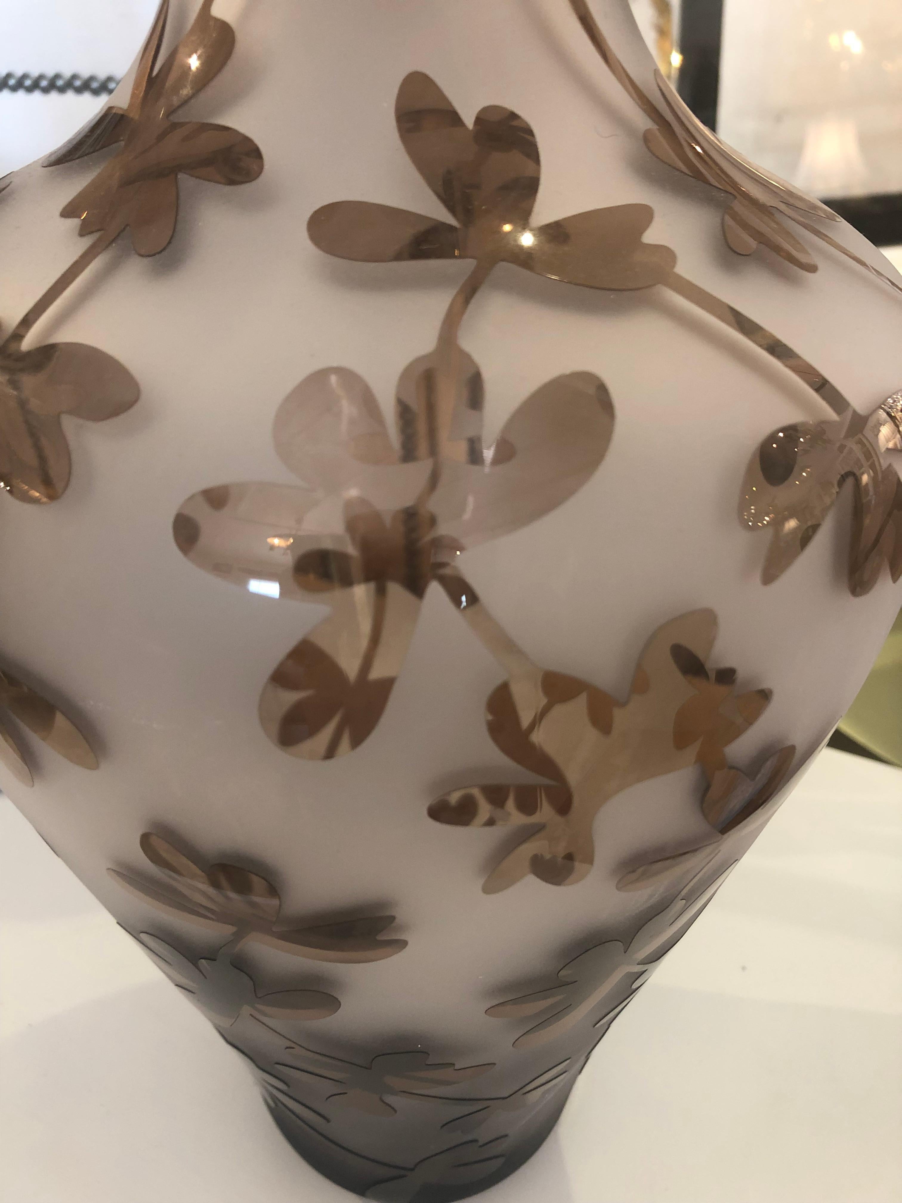 A beautiful large vase having white opaque glass with clear grey tinted stylized floral pattern. Makes a lovely statement accessory.