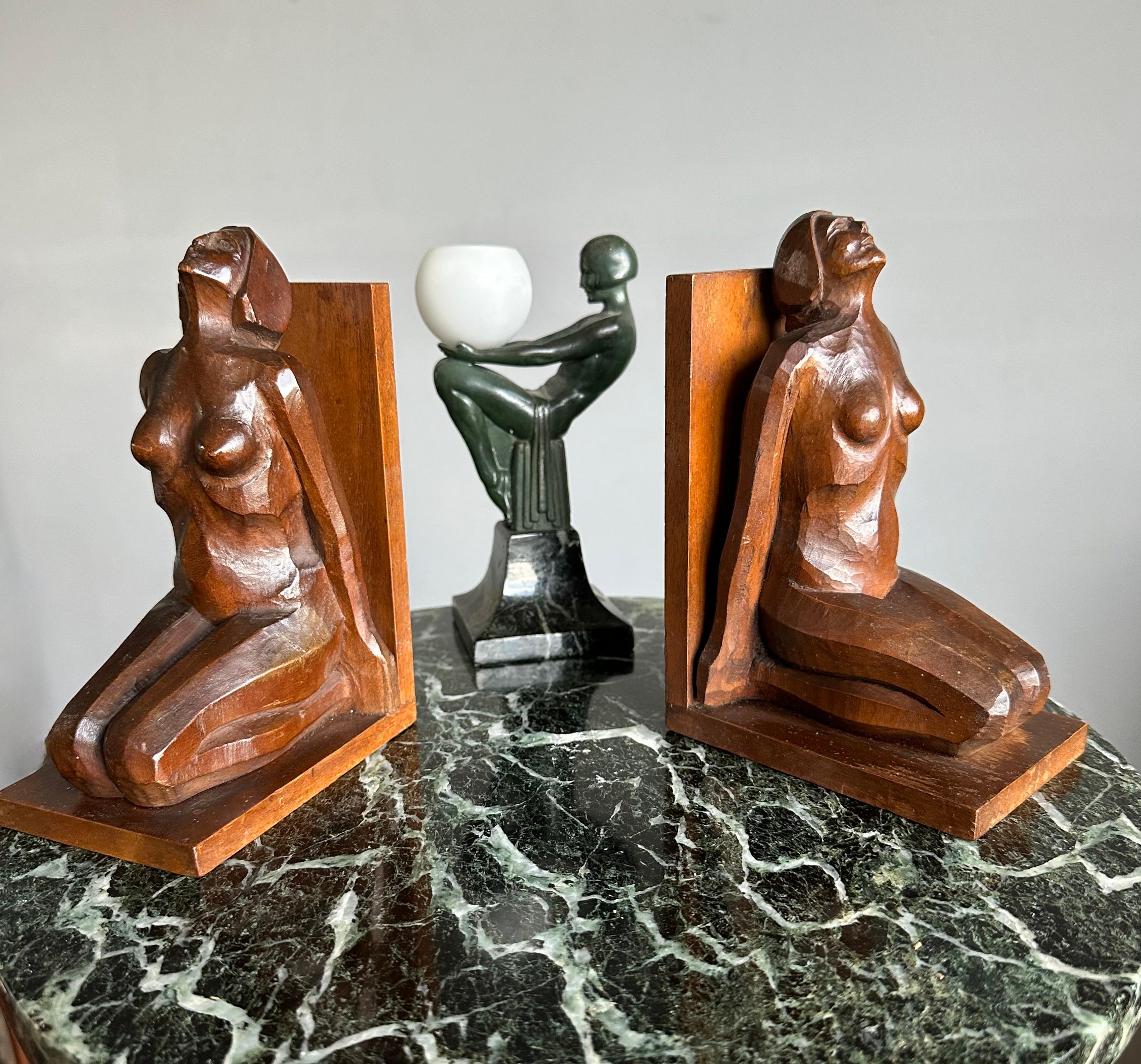 Impressive and highly stylish female bookends, hand carved out nutwood.

The artist who handcarved these wonderfully stylized, sitting female bookends has perfectly captured the natural posture of two sitting nude females. We are not sure if these