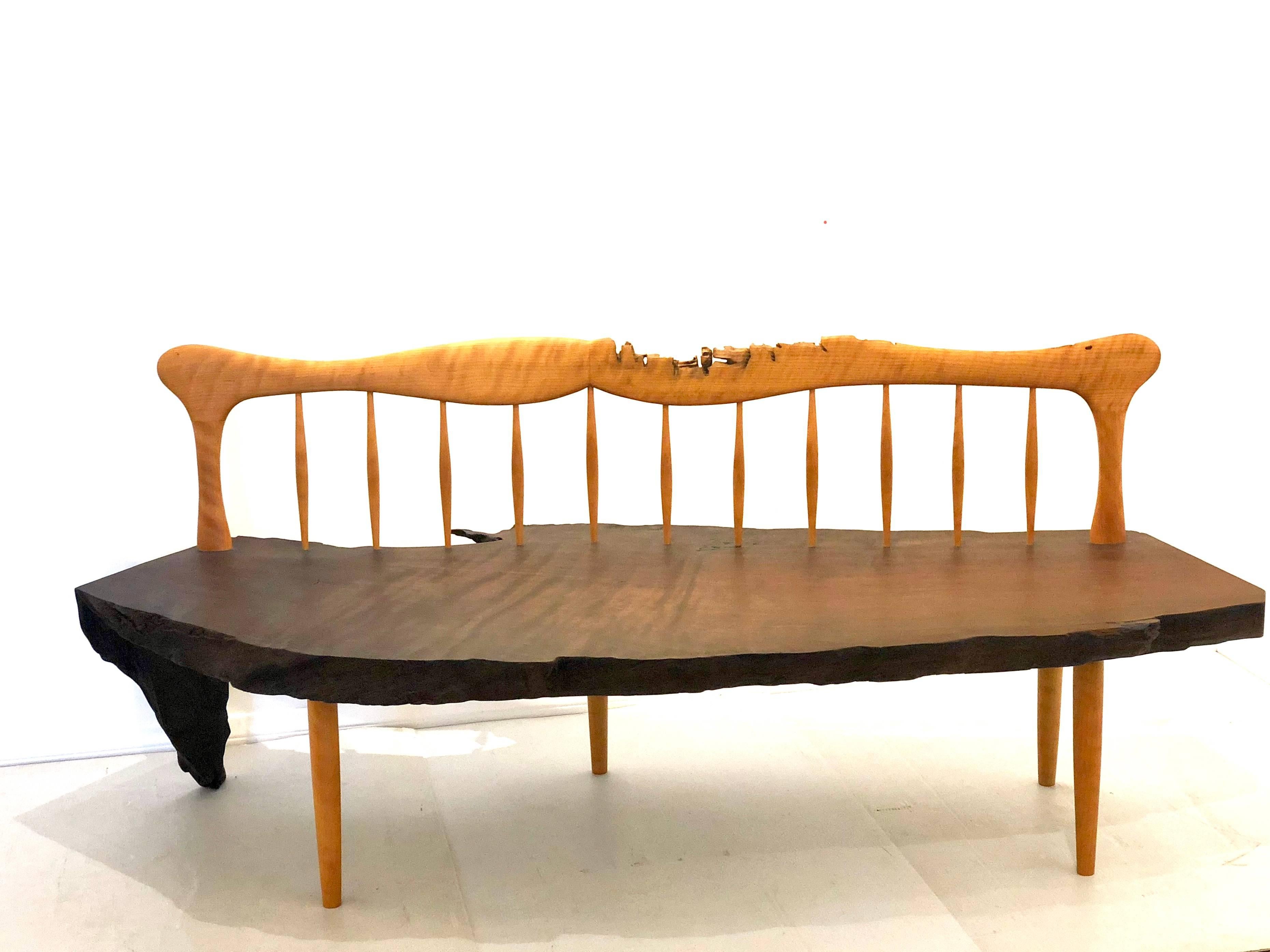Beautiful well done large bench by San Diego Craftsman Joe Bedford, circa 2000, red wood and maple combination, solid and sturdy live edge, nice hand rubbed oil finish.