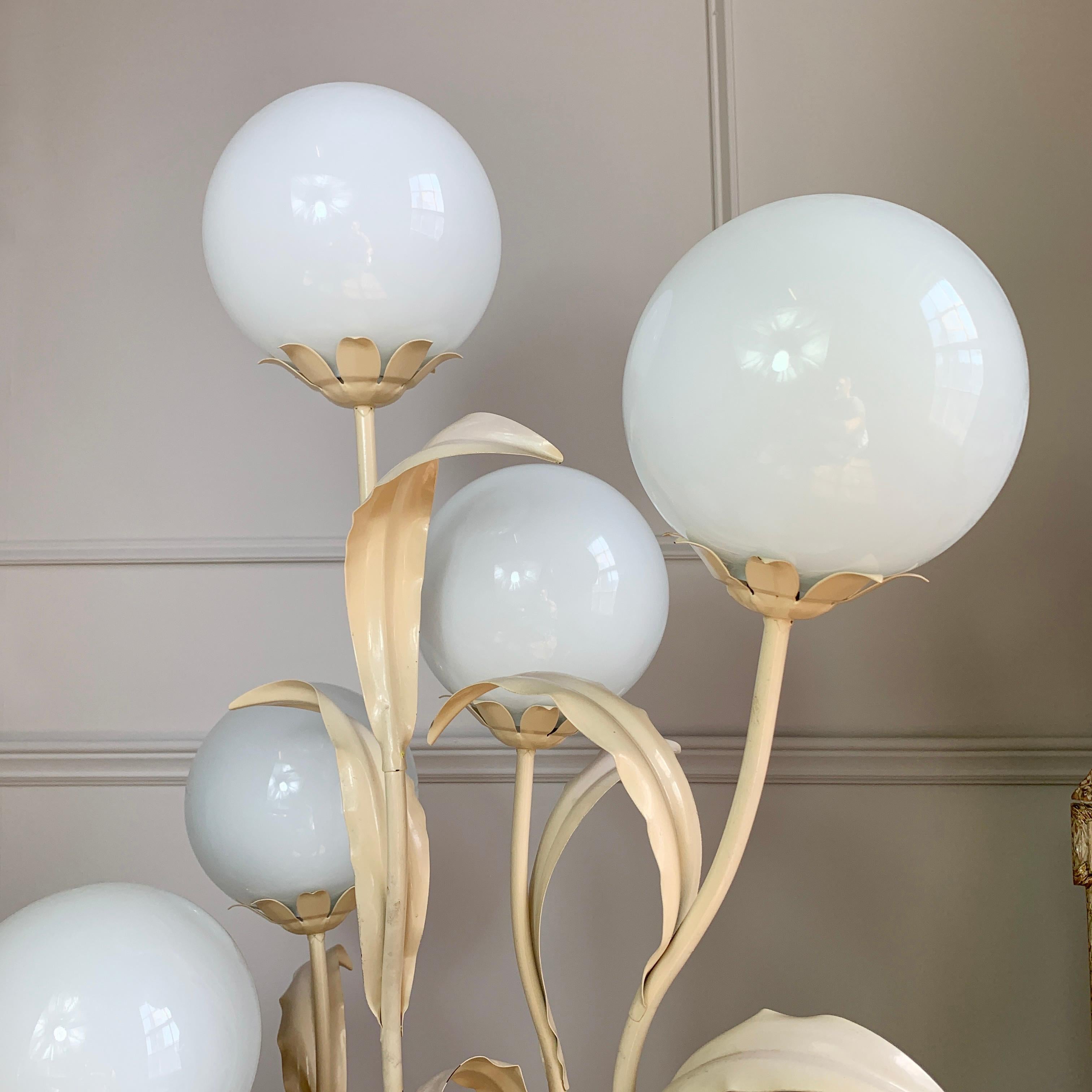 This is an exceptionally pretty floor lamp by Hans Kogl, the tall foliage design is set against 6 opaque glass globe covered light fittings. The white enamelled finish gives the piece a very attractive appearance on or off. The entire light is