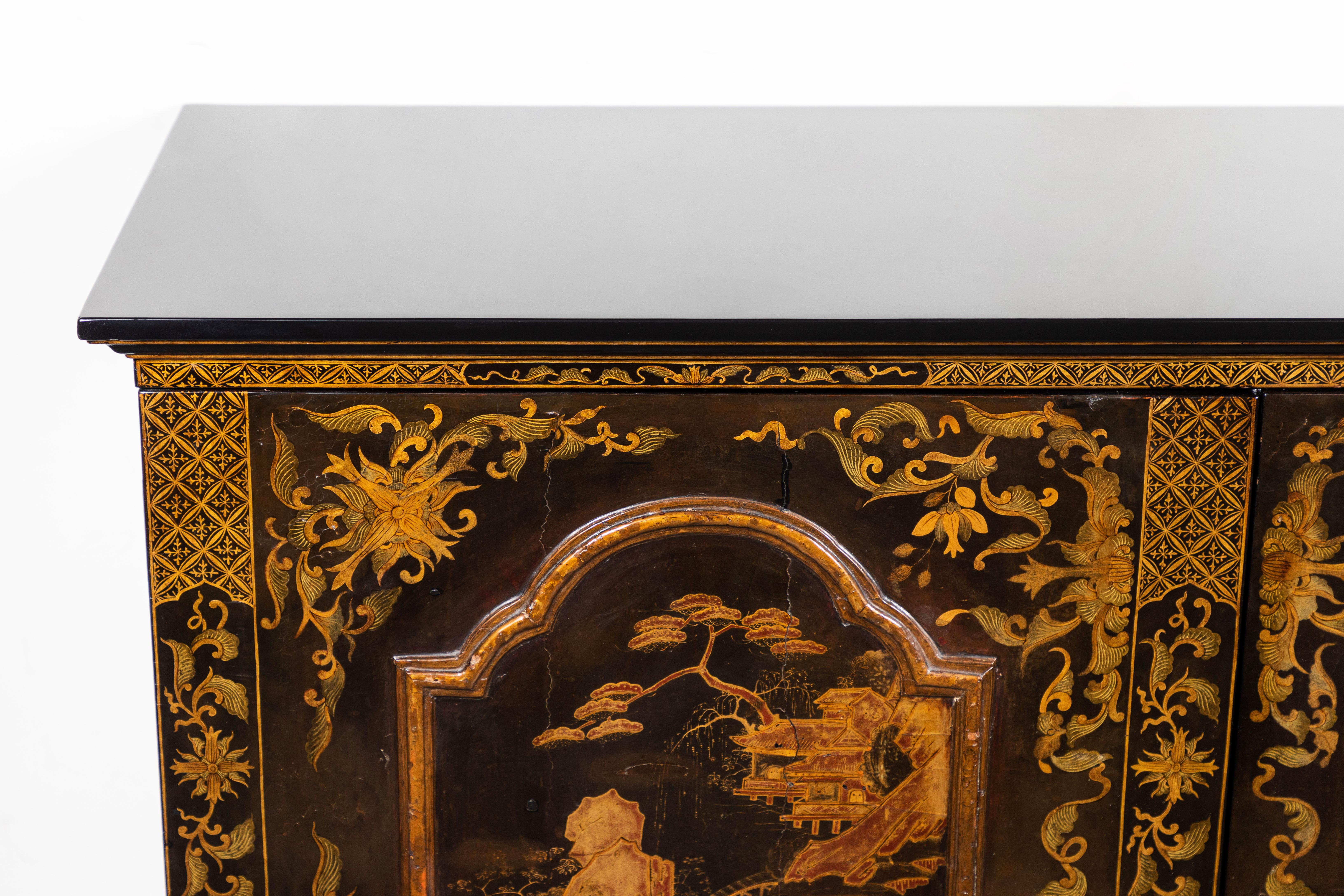 Absolutely beautiful, mixed wood, lacquered, hand painted and gilded, two-door, Italian chinoiserie sheet music cabinet on a petite, raised foot base. The stunning doors date from circa 1850 while the newer case and interior shelving dates to the