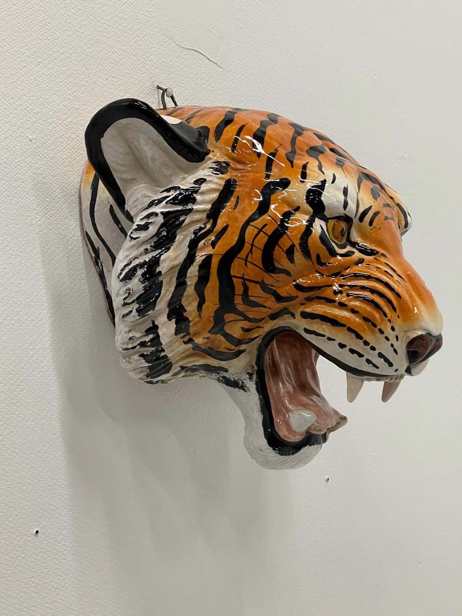 Eye catching wall art tiger head made of hand painted Italian terracotta.
