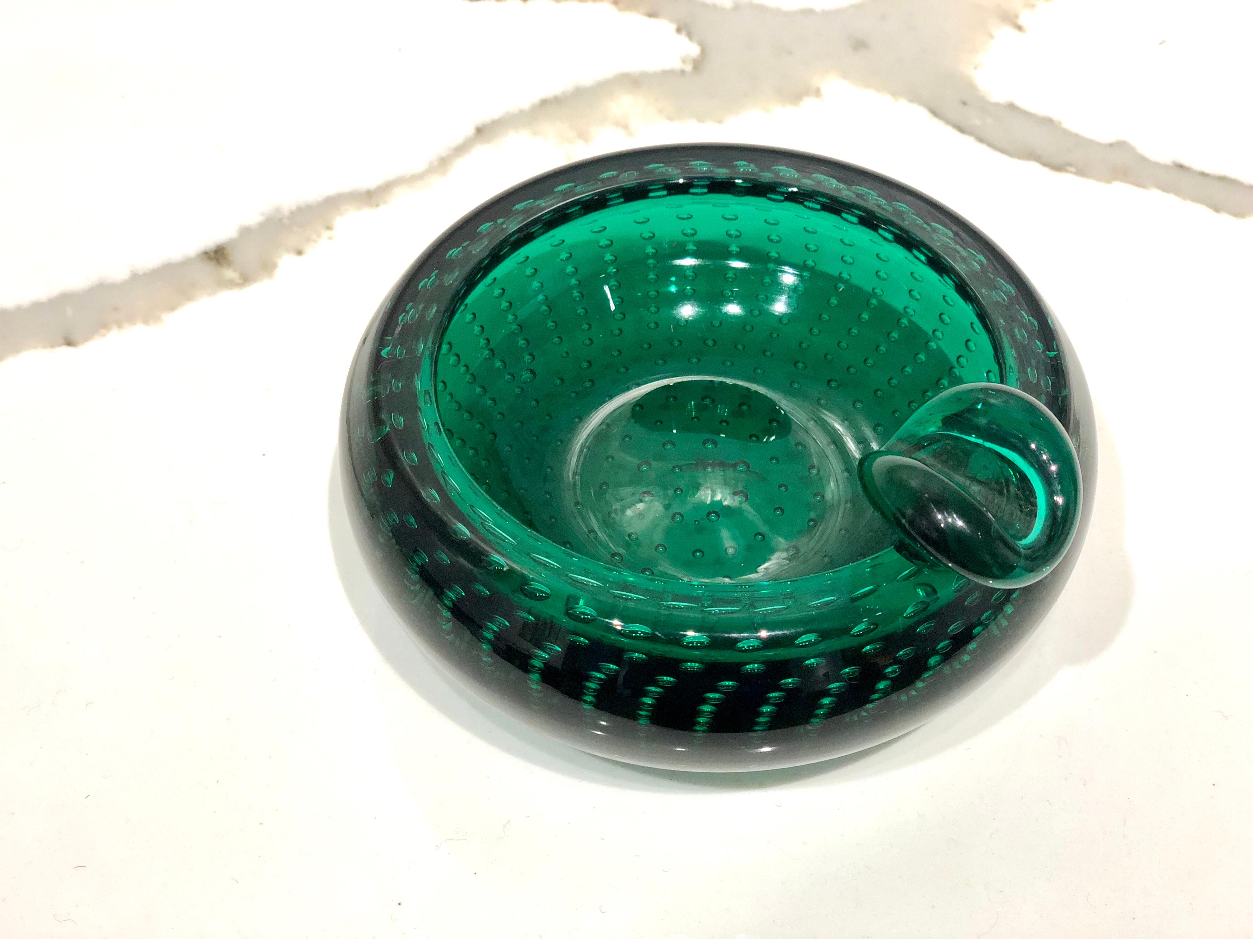 Incredible unique piece of thick green glass, simple elegant a very clean piece, no chips or scratches, circa 1970s, with air bubbles inside. Italian Murano beautiful.