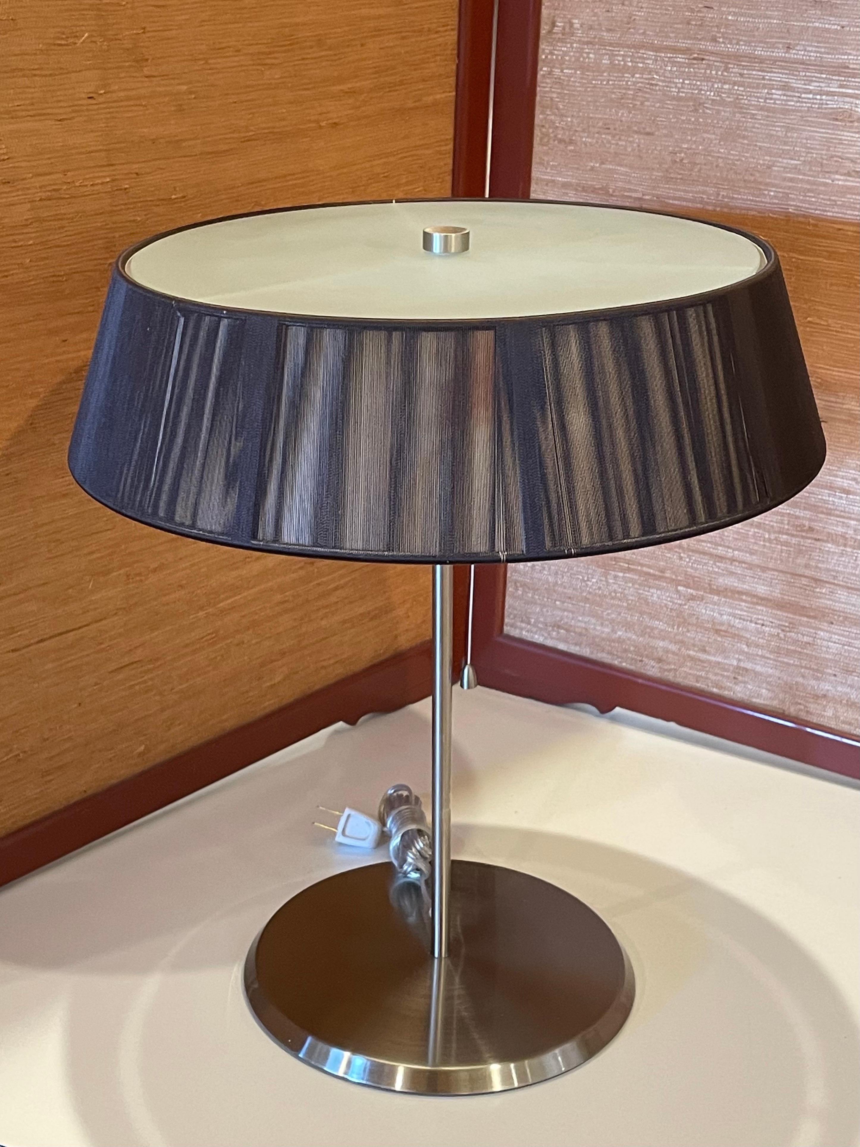 Cotton thread table lamp available in mocha, with satin white glass inner diffuser. Stainless steel base freshly rewired converted to American voltage, some light marks on the inner shade as shown.