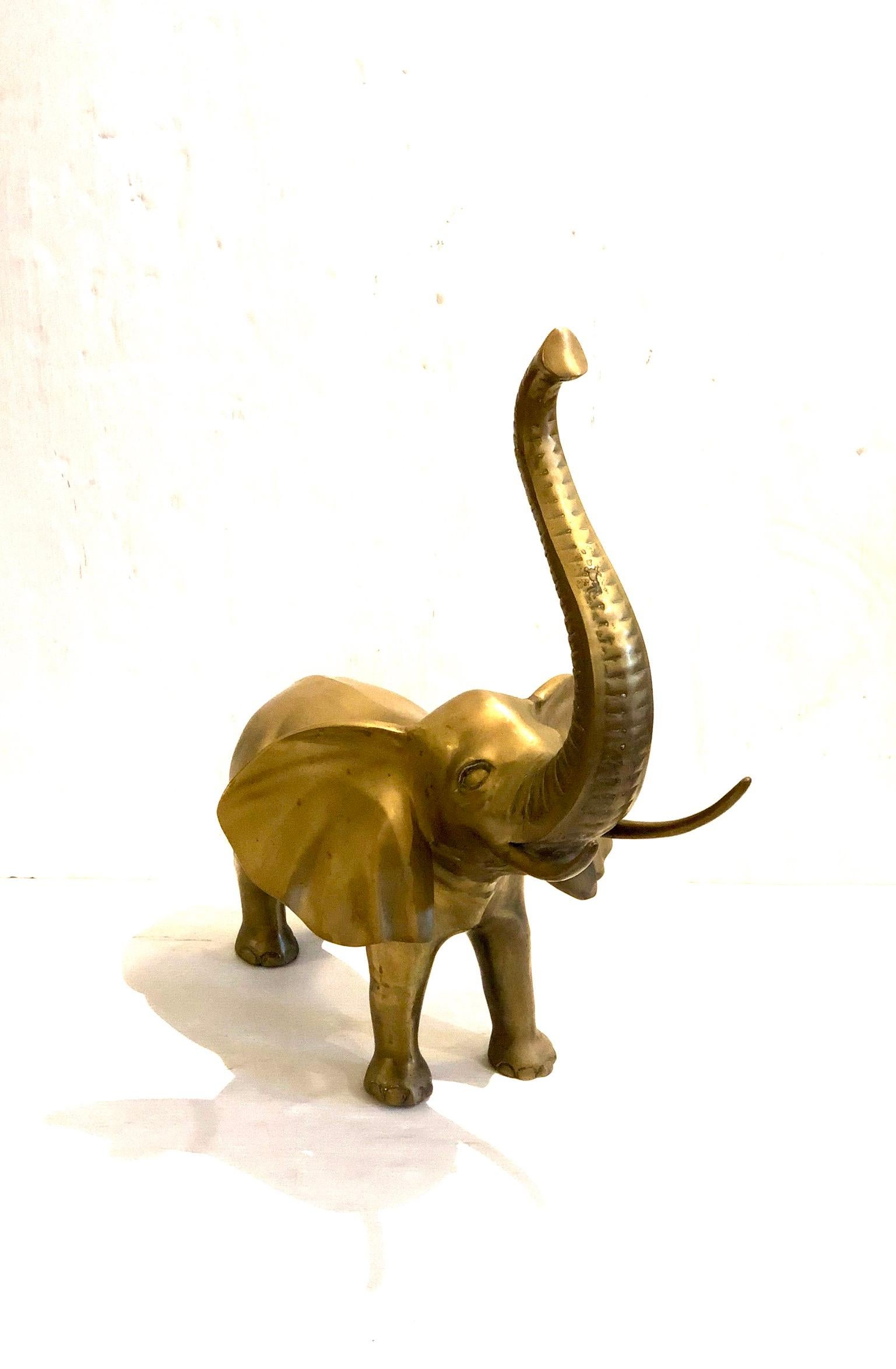 A good luck beautiful large elephant sculpture, in brass nice patina circa 1970s can be polished but it’s sold AS/IS condition.