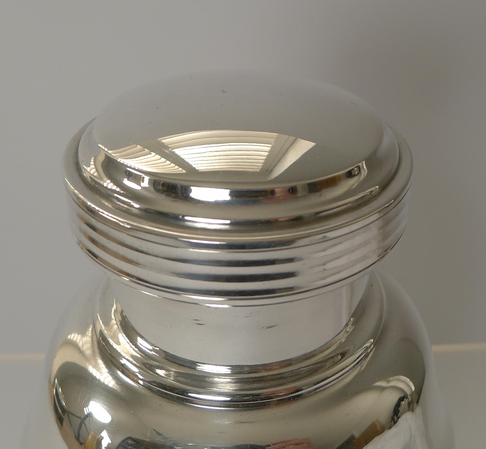 A strong shape and good proportions make this striking cocktail shaker a handsome example to adorn the finest of bars.

Made from silver plate, it has just returned from our silversmith's workshop where it has been professionally cleaned and