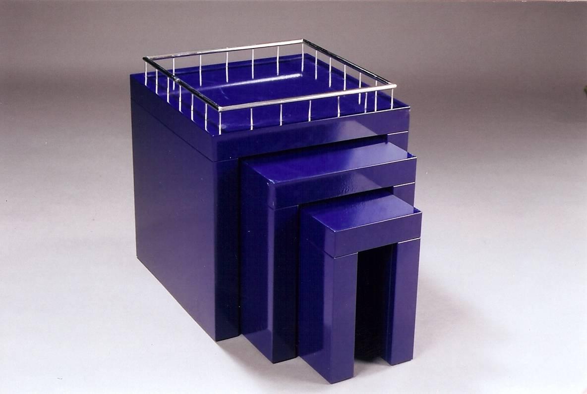 Marco Zanini (b. 1954)

A rare and striking set of three early square geometric nesting tables by Italian tastemaker Marco Zanini, co-founder with Ettore Sottsass of the Memphis Milano Group. In electric blue enameled steel crowned by a chromed