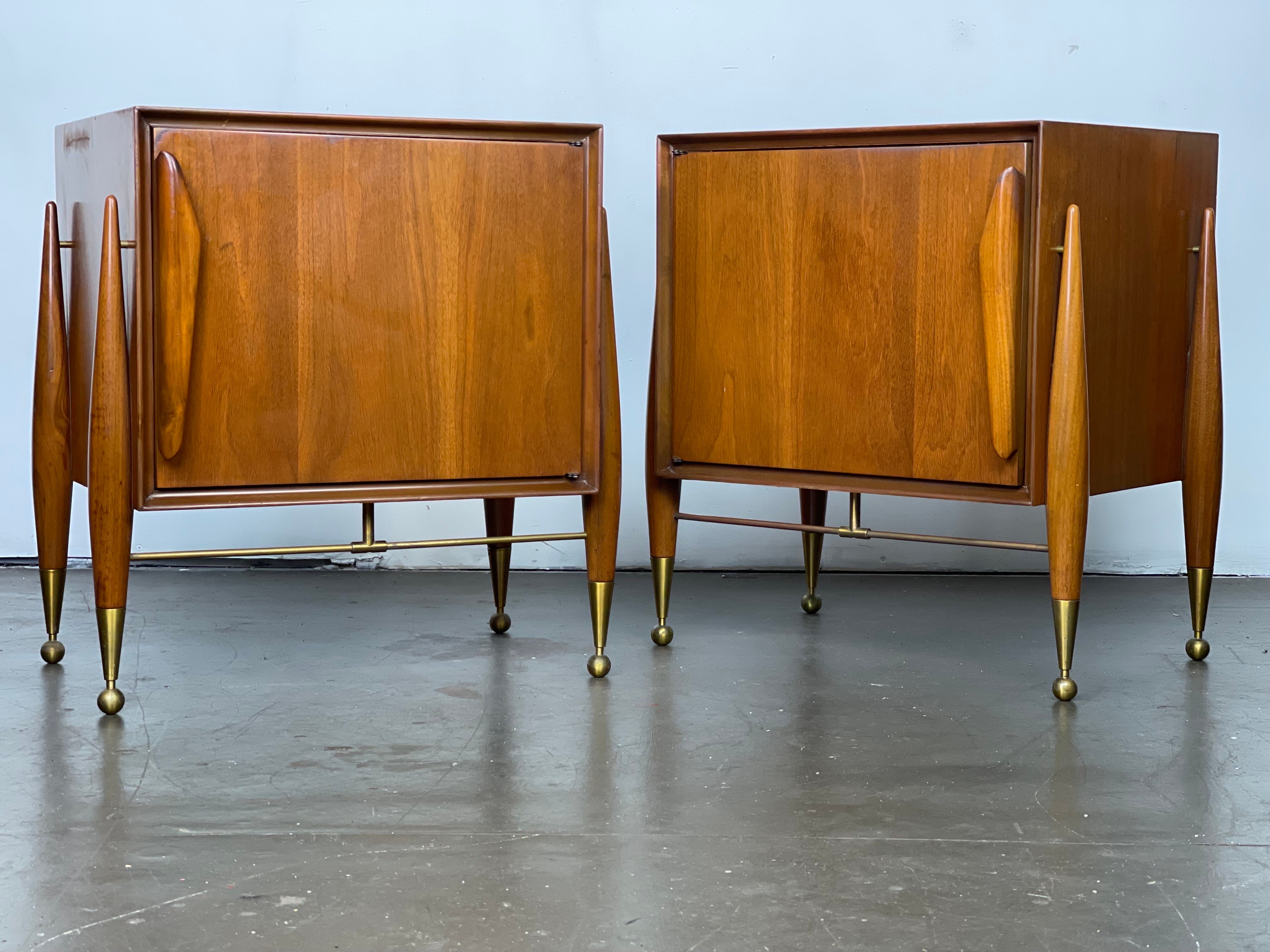 Excellent and striking design by Specialty Woodcraft, 1957 of Walnut glass and brass accents. Lovely exoskeleton legs show off the brass accents marvelously. 
Original condition - multiple areas of presentable wear. Please see pics of the great