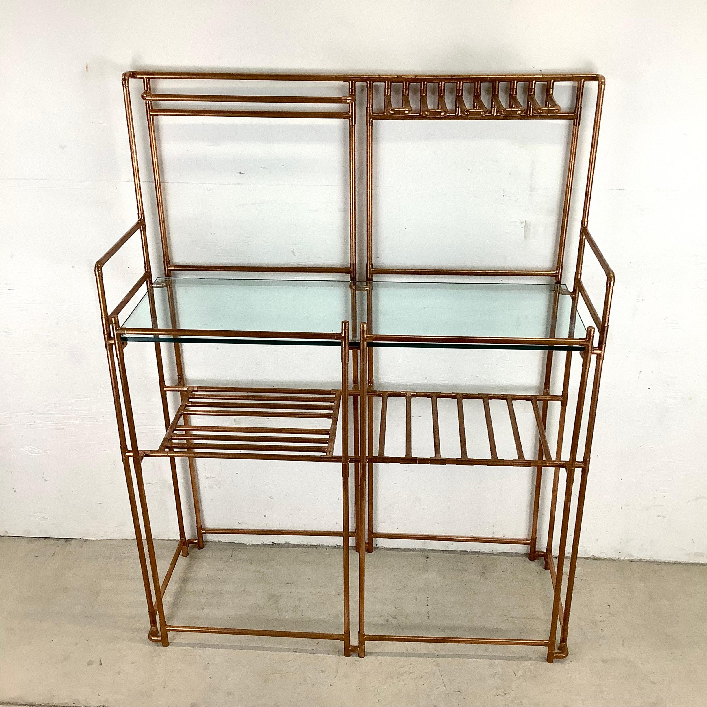 Introducing this Vintage-Inspired Copper Pipe Bakers Rack with Glass Countertop, the perfect addition to your kitchen or dining area. This unique piece blends rustic charm with modern elegance, creating a captivating focal point that is sure to