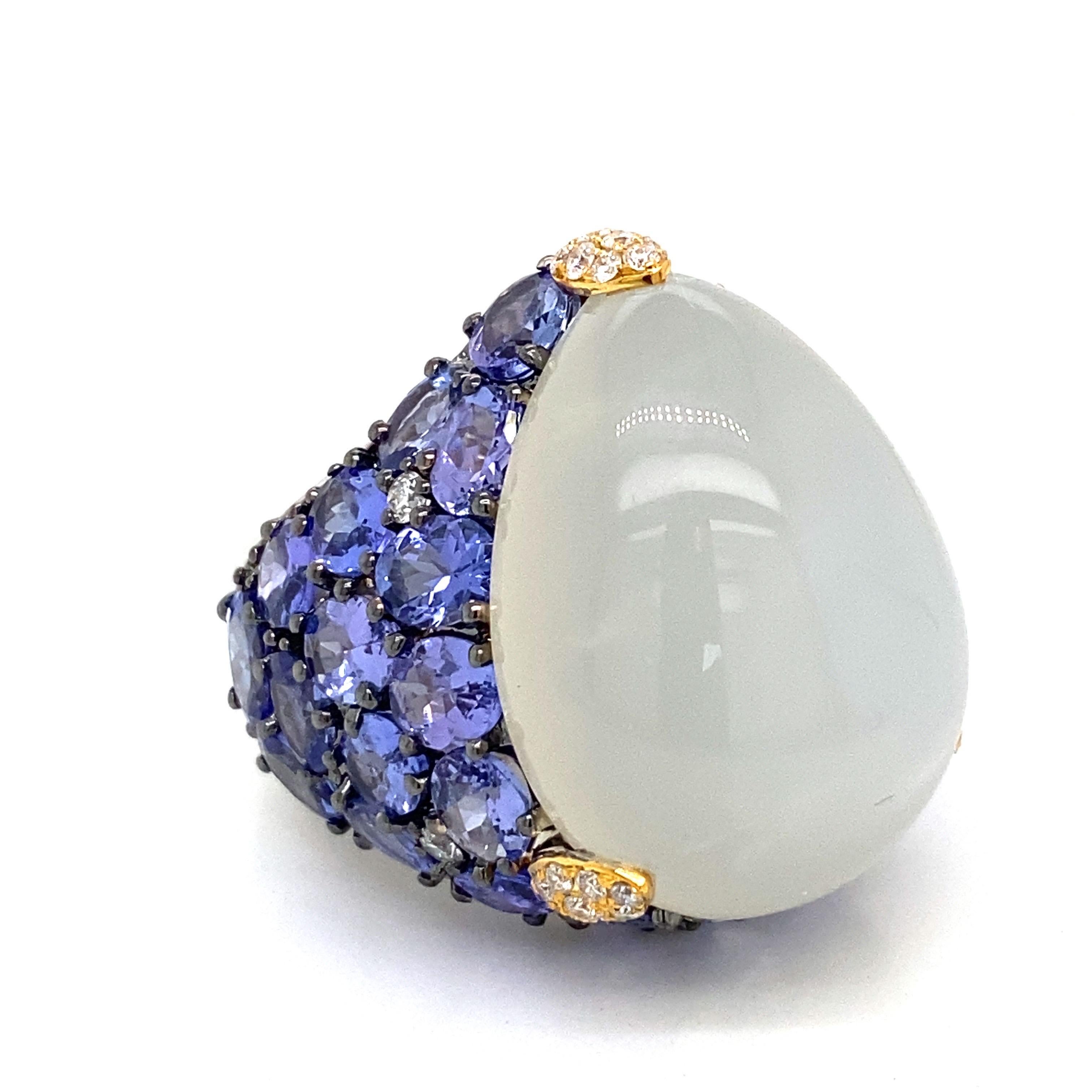 featuring Tanzanite and a large cabochon moonstone set in the center totaling approximately 41.00 carats. 