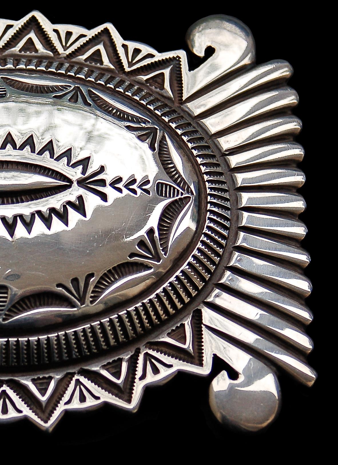 feathered indian belt buckle