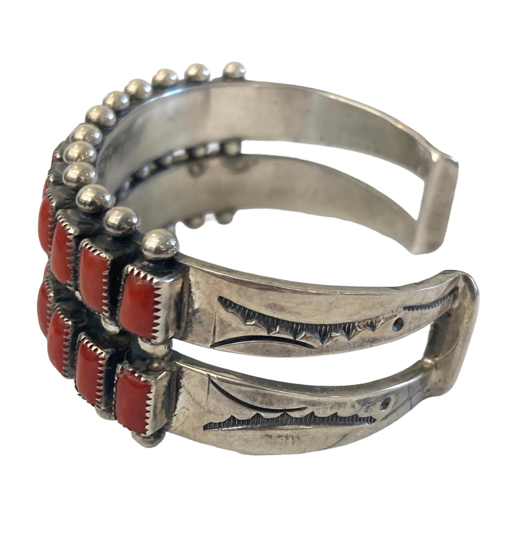 This Striking Navajo Sterling Silver Red Coral Channel Cuff Bracelet is unlike any I've seen in my 30 years of offering fine jewelry. This mid-century piece weighs an impressive 71.71g. The channel work is impeccable as are the hand-stamped sides,