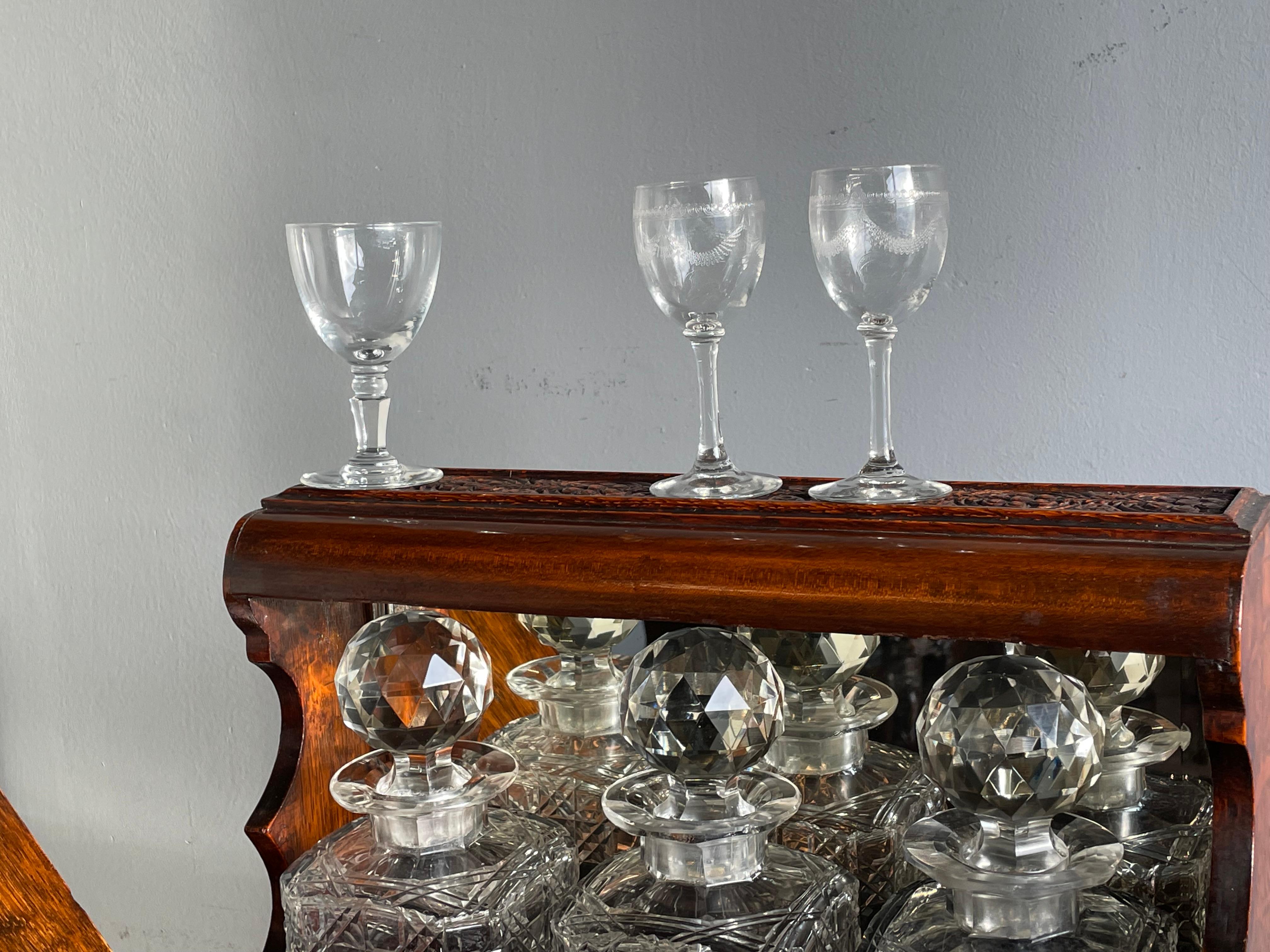 English Striking Oak & Brass Tantalus with Whiskey or Liqueur Crystal Decanters & Drawer For Sale