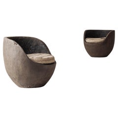 Striking pair lounge chairs sculpted by hand from solid palmwood, 1930s