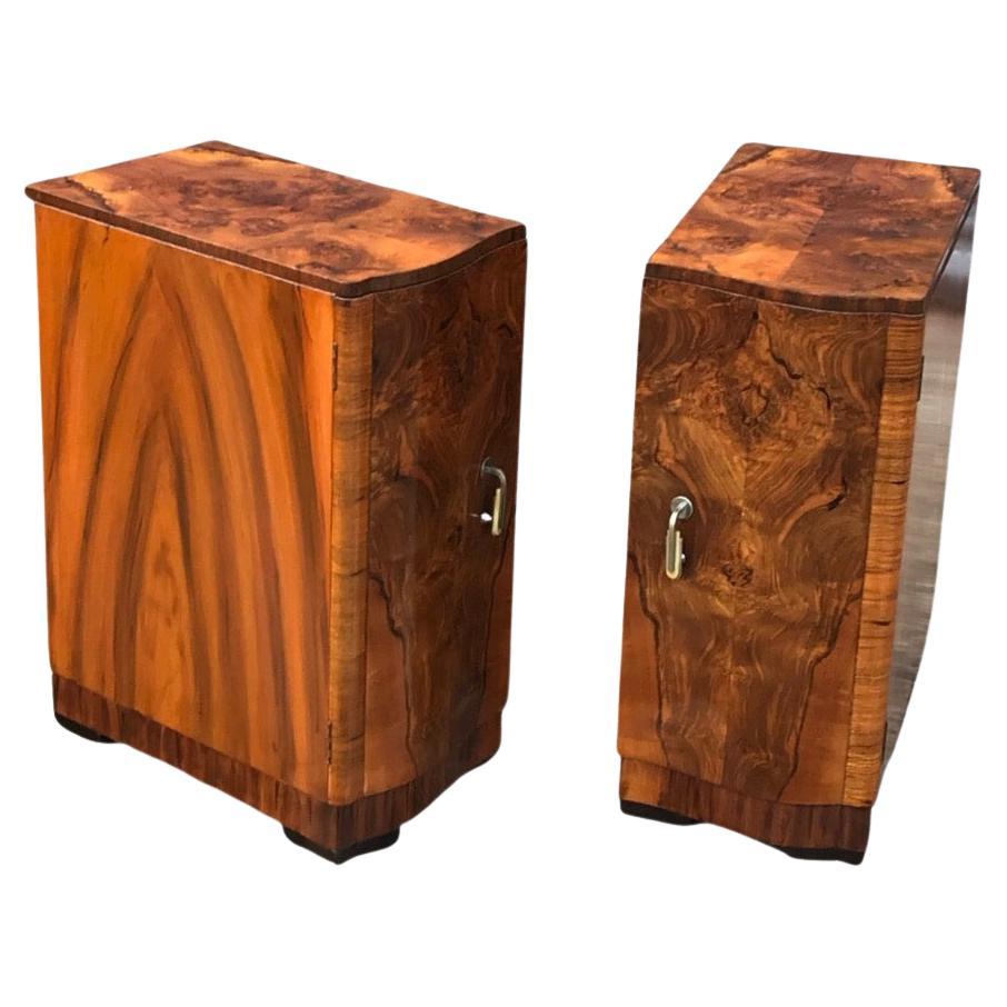 A stunning pair of Art Deco bedside cabinets/ nightstands in highly figured walnut. They are a handed pair, left and right and serpentine fronted outline. The stunning veneers to the tops and doors all match each other perfectly and are very