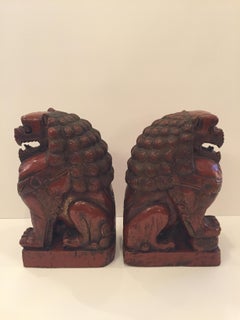 Striking Pair of Carved Wood Foo Dogs in Cinnabar Red
