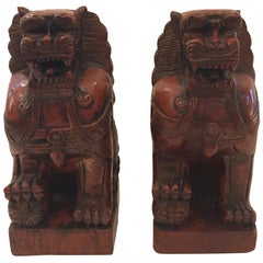 Striking Pair of Carved Wood Foo Dogs in Cinnabar Red