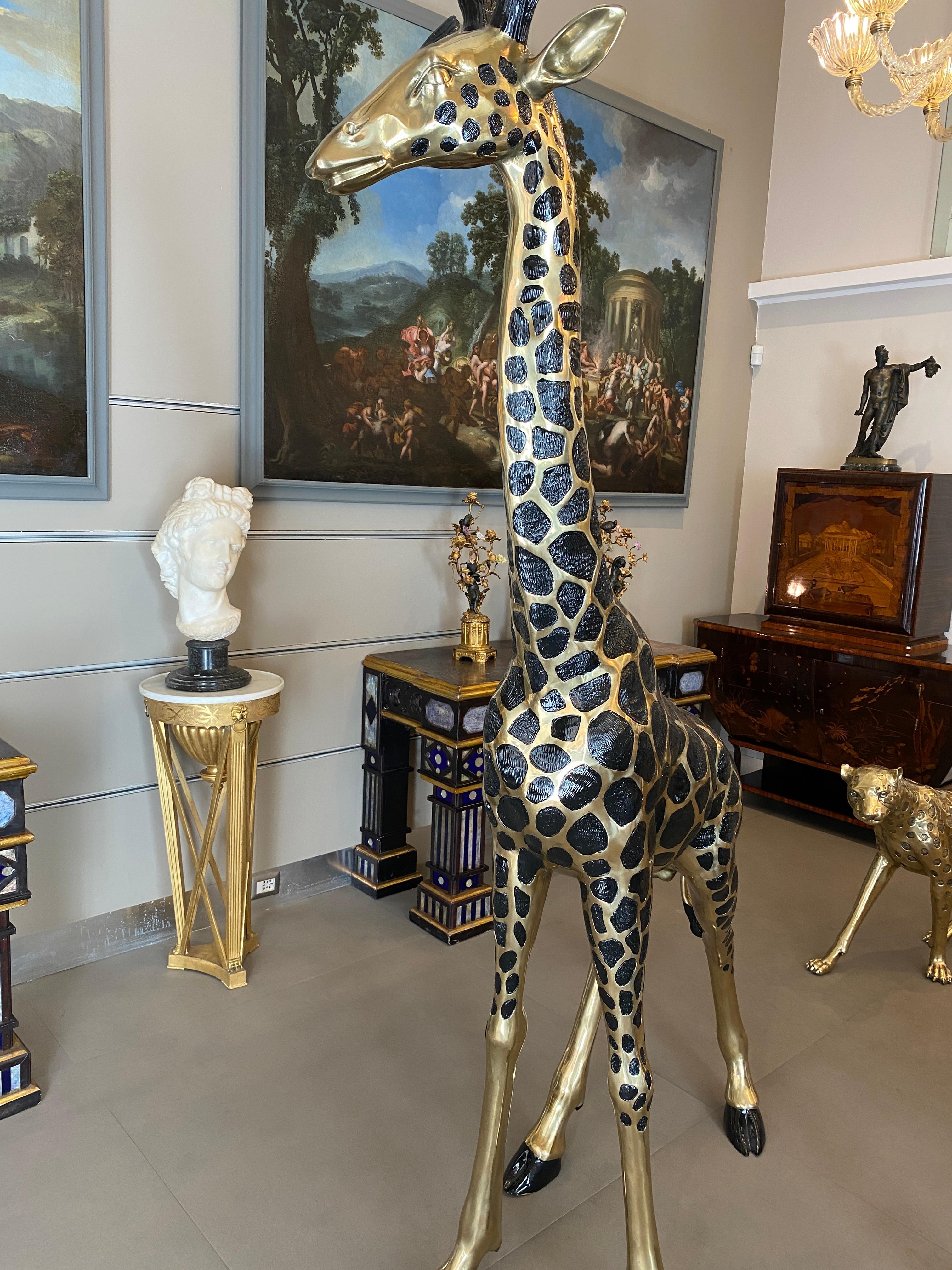 A pair of outstanding giraffe sculptures . 
The item will be well-suited to either an indoor or outdoor setting.
