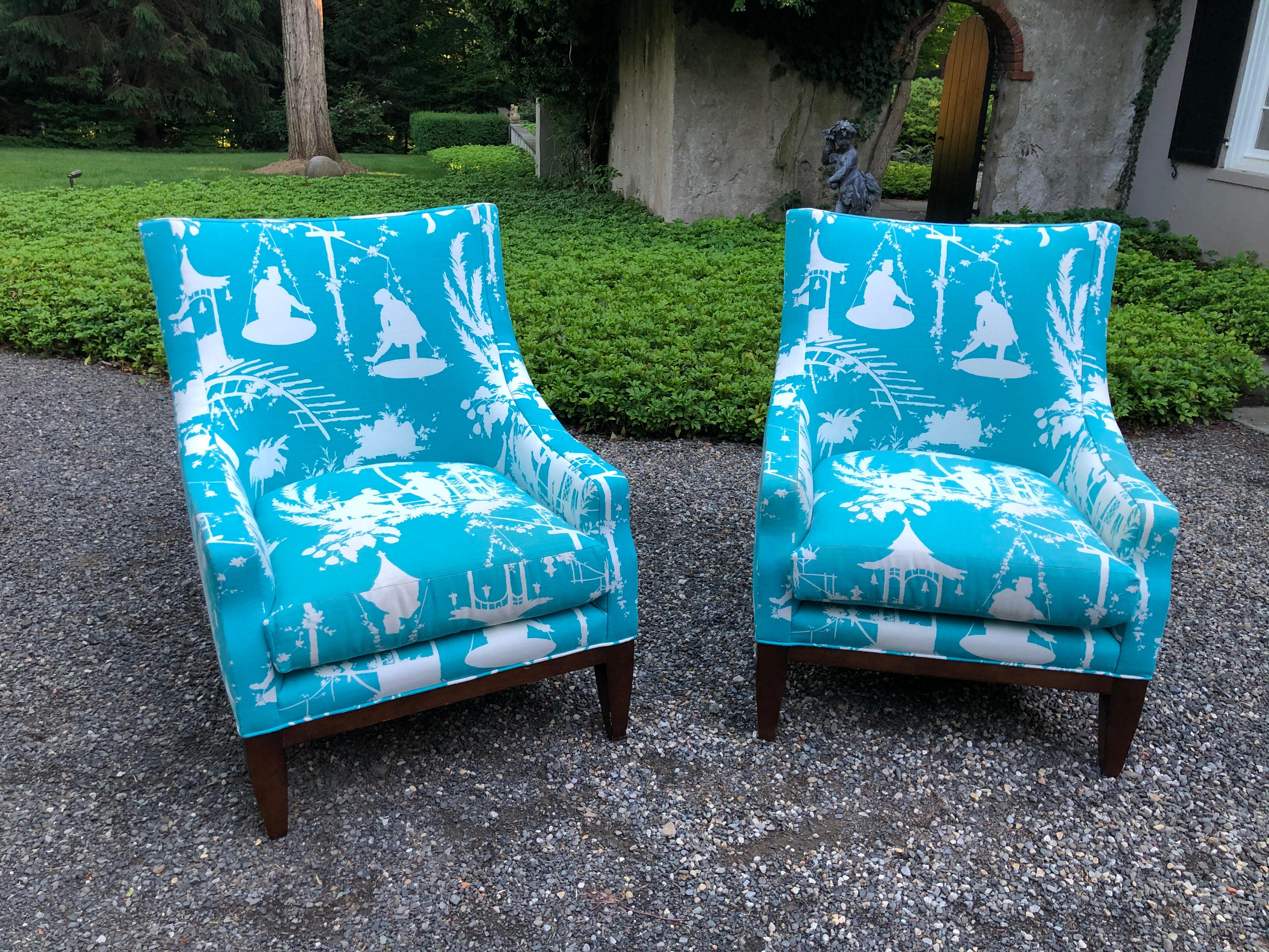 Fabulous pair of fireside chairs by Lee Jofa. Upholstered in Thibaut’s South Sea fabric having a curved back and mahogany legs. They are quite heavy and extremely comfortable. Chairs have been professionally cleaned and are in excellent condition.