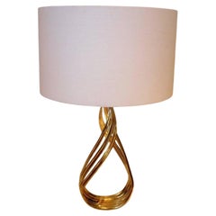 Striking Pair of Patinated Twisted Bronze and Lucite Tall Sculpted Lamps