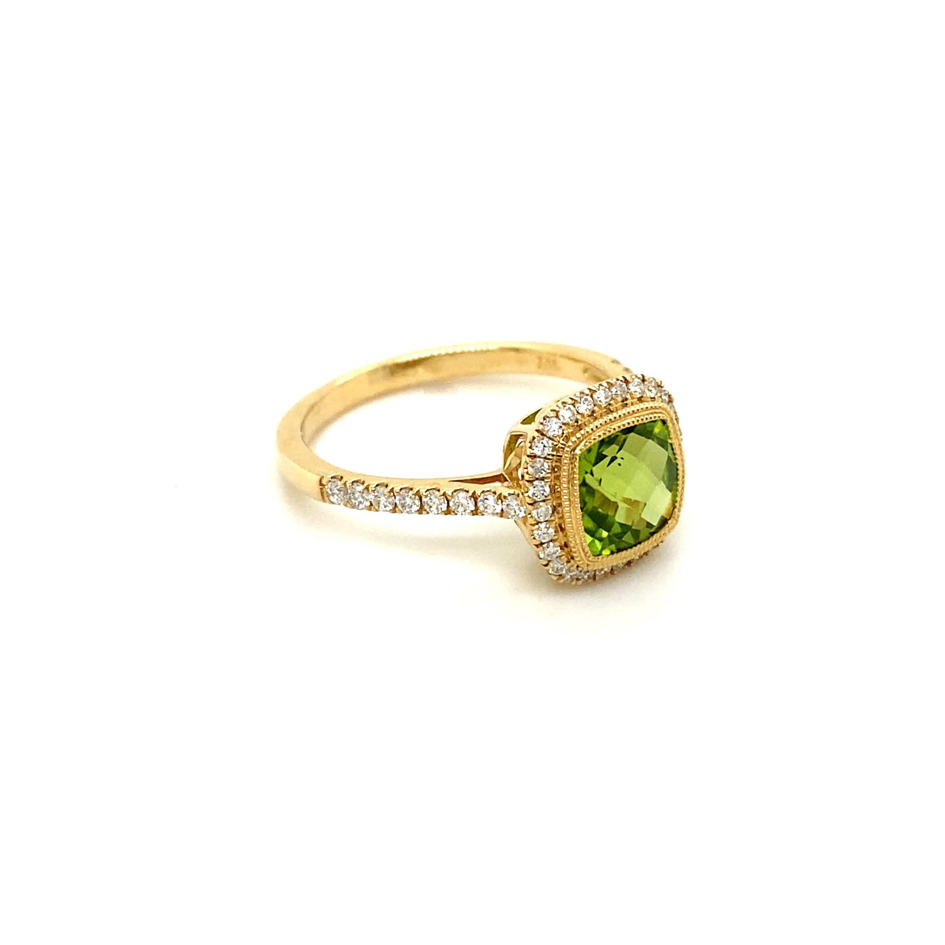 This beautiful and unique peridot ring will look lovely on anyone’s finger! The 1.60 carat peridot is checkerboard cut into a lovely cushion shape that sparkles from every direction! The diamonds around and going down the band accent the peridot