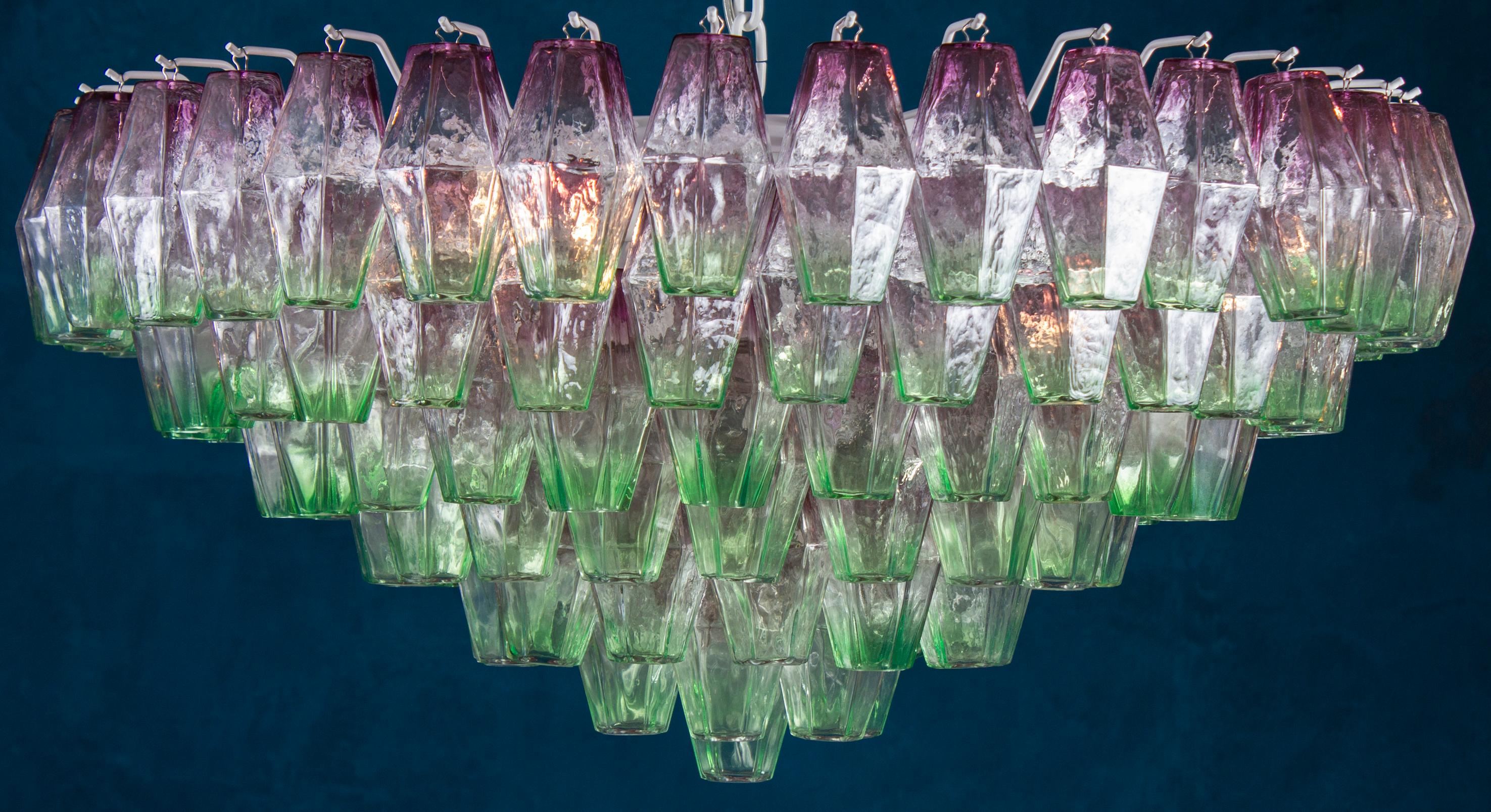 Midcentury large Poliedri chandelier with rare combination of pink and green colored murano glass.
Available also the pair.
  