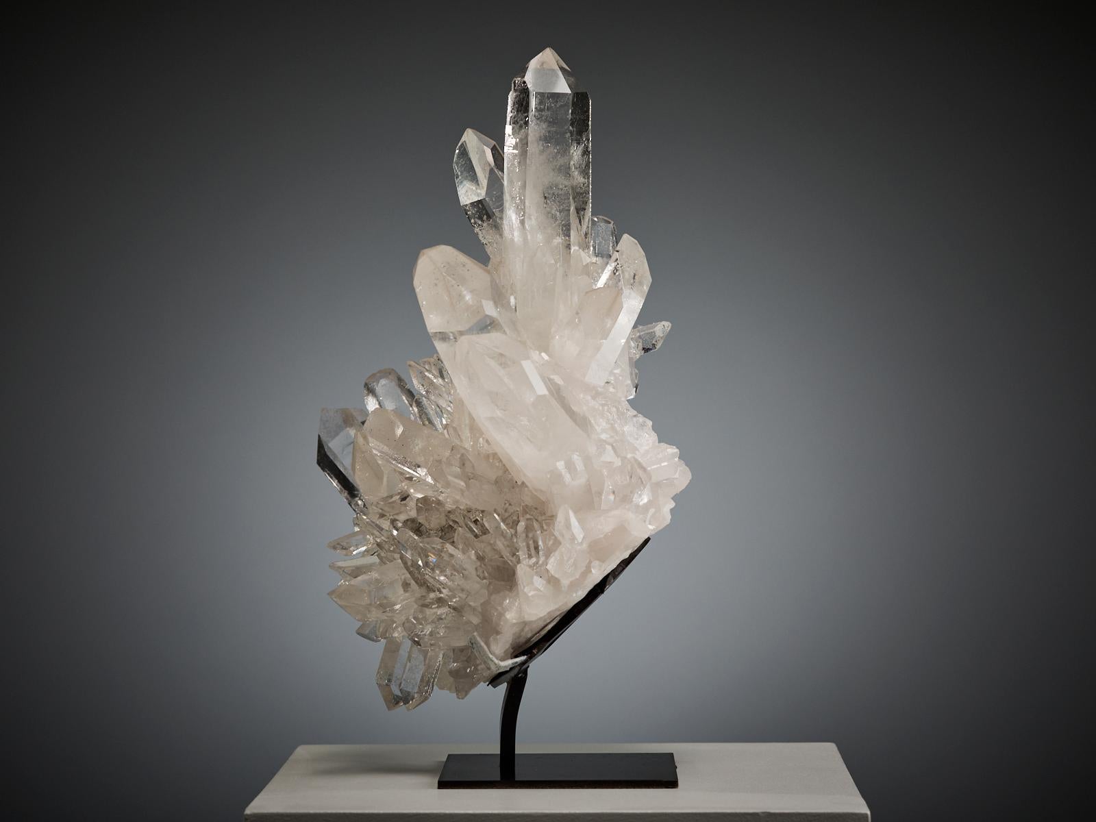 A beautiful natural quartz cluster from Brazil, composed of clear, transparent crystals of different shapes and sizes growing together in perfect harmony.

The piece has a luminous presence, with brilliant clarity and a refined, sculptural structure