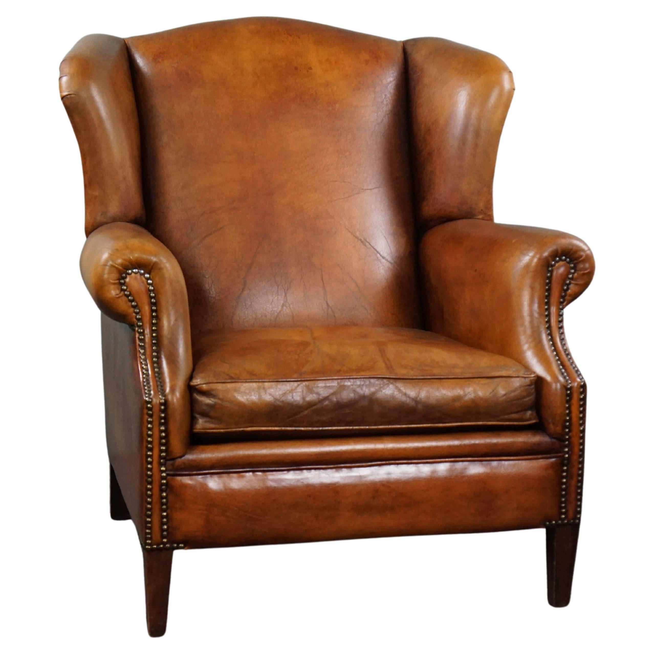 Striking sheep leather wing chair For Sale