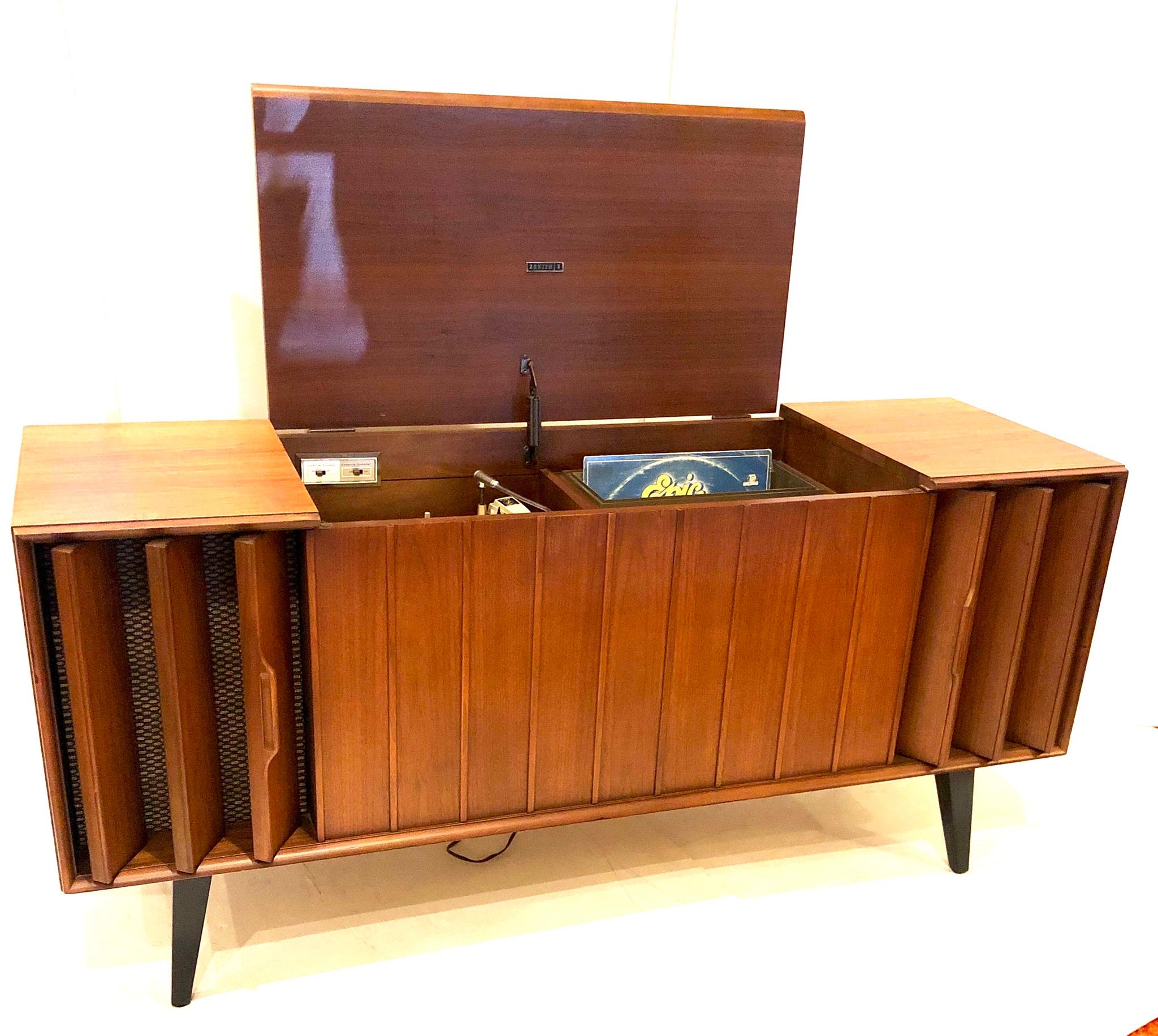 Totally restored American walnut stereo cabinet by Zenith, circa 1950s, turntable and fisher stereo receiver, with extra plug to connect your I phone or MP3 player, the item has been serviced and works good, it’s been taken all apart and refinished