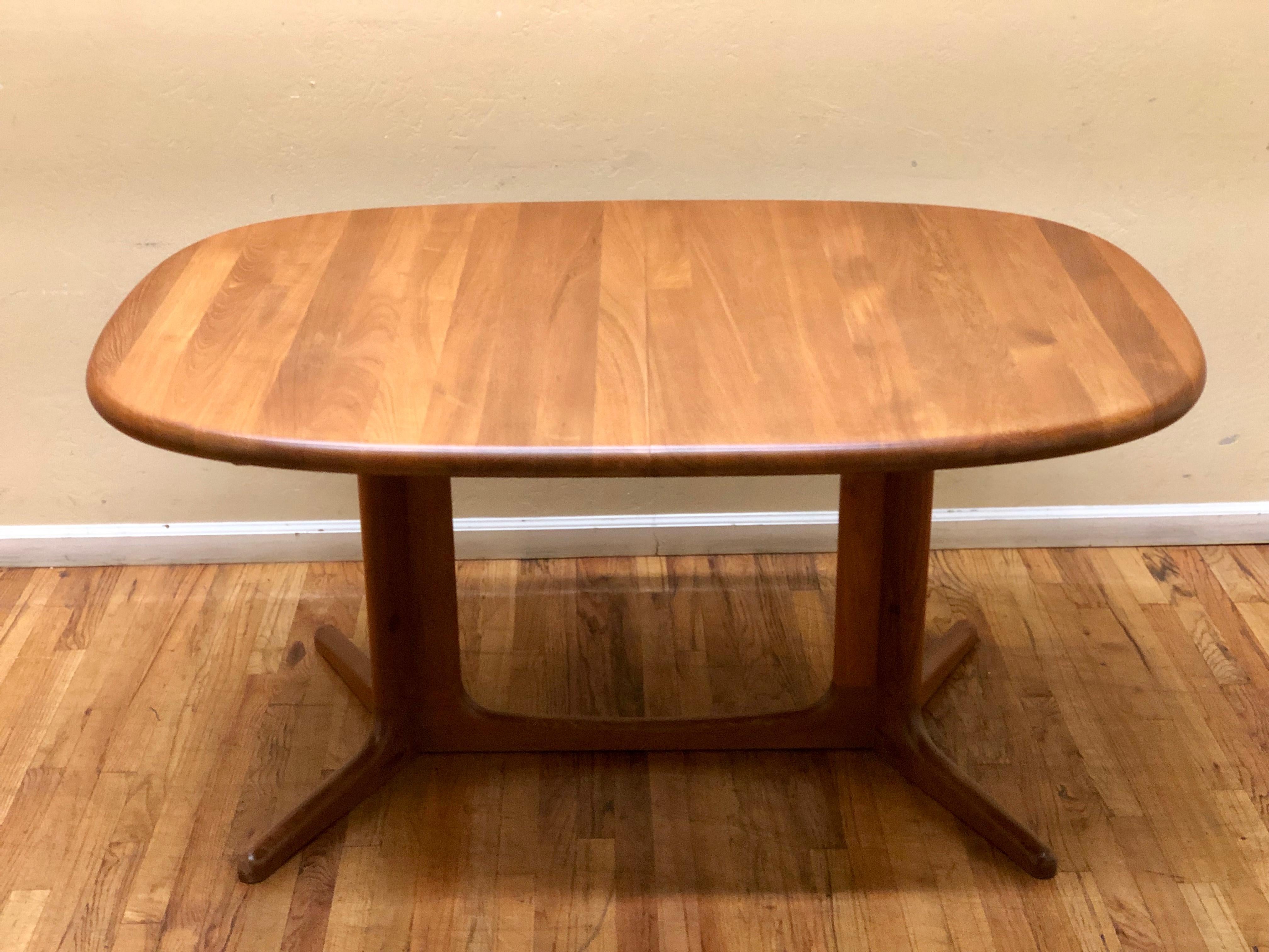 Beautiful solid teak dining table Danish design by Glostrup with quality control tag and freshly refinished, 2 leafs each measures 19.25 inches and the table its 60 inches wide the close.