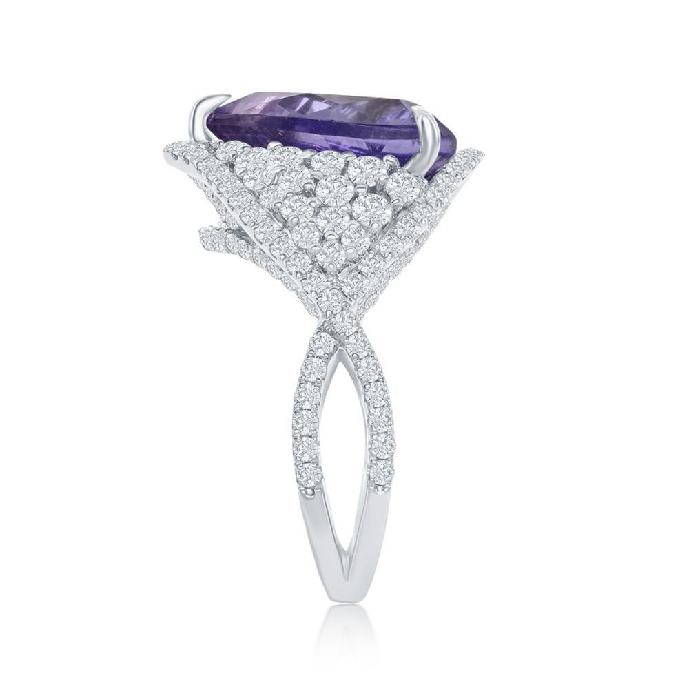 18k White Gold 7.91ct Violet Tanzanite and 1.94ct Diamond Ring 

This tremendous violet color Tanzanite benefits from the unique
triangular style of round diamond band
Item: # 03108
Metal: 18k W
Lab: Gia
Color Weight: 7.91 ct.
Diamond Weight: 1.94