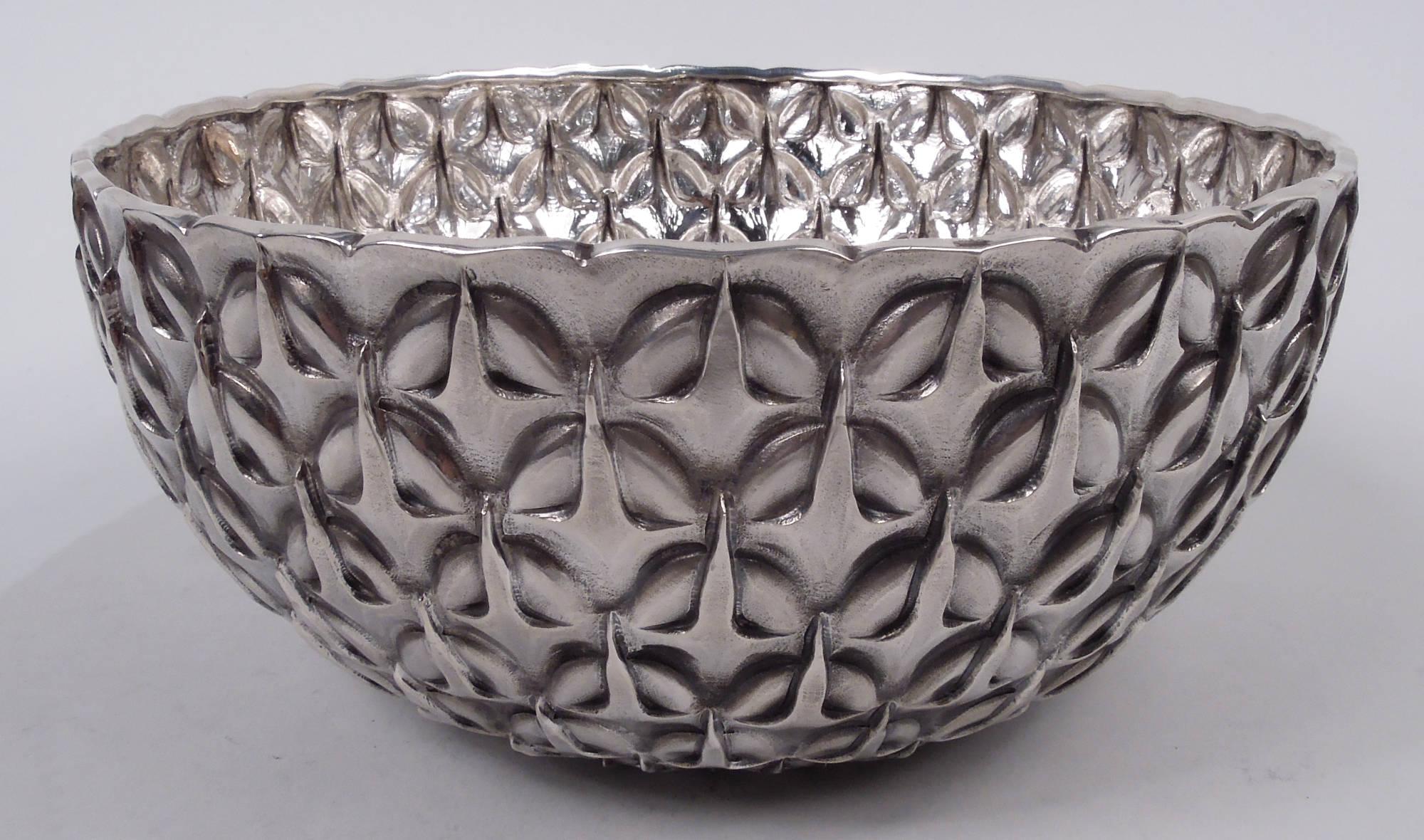 Striking Modern Classical sterling silver bowl. Retailed by Tiffany & Co. in New York. Round and curved. Chased imbricated and graduated egg-and-dart ornament. Tactile with beautiful shimmer. Marked “Tiffany & Co. / Sterling / Portugal”. Heavy