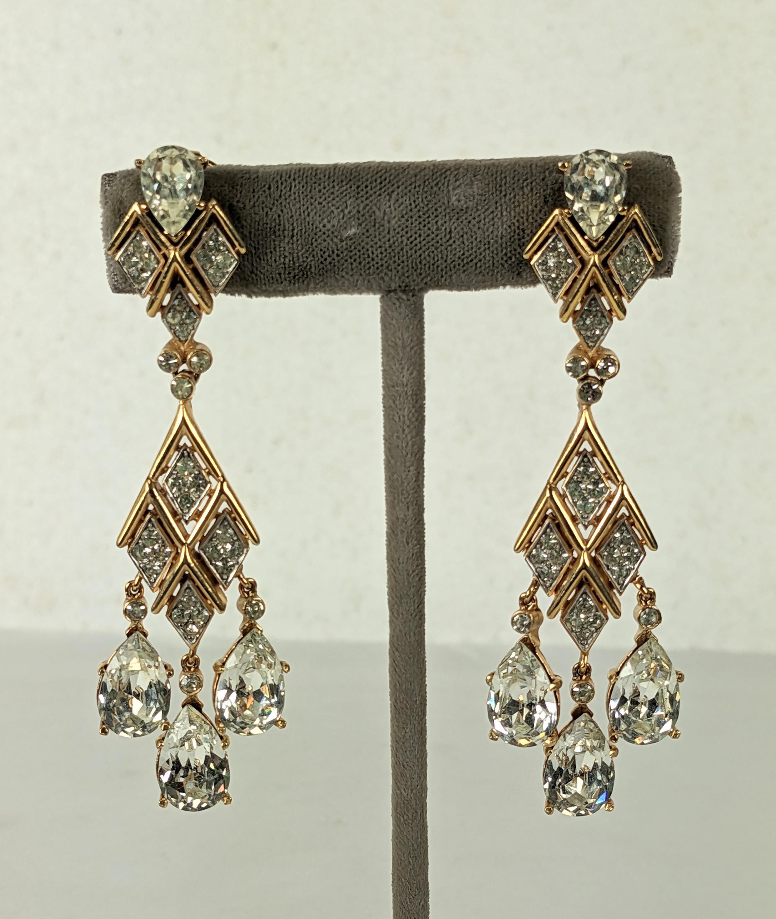 Imposing and striking articulated Trifari Crystal Drop Earrings from the 1960's. Clip earrings with a grid of pave work set within a gold frame, with 3 large pendant drops. 
Clip back fittings. 1960's USA. 3
