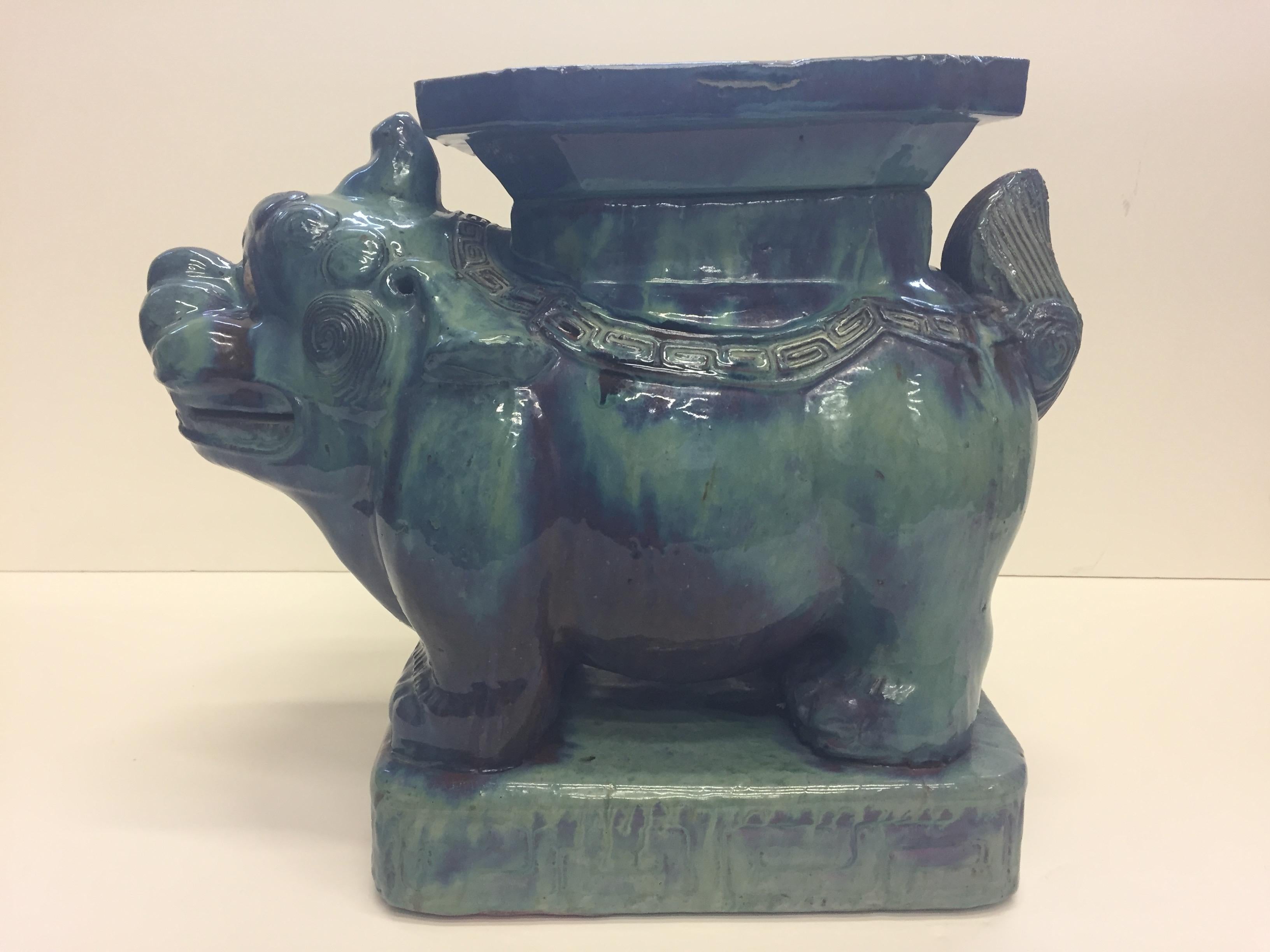 A great looking Asian muted turquoise glazed ceramic garden seat with foo dog motife.

  
