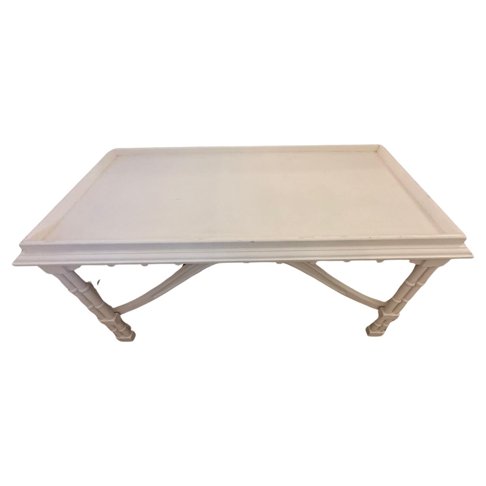 Very pretty vintage Gothic Revival coffee table that's been updated with a fresh coat of white paint.  The scalloped underside and central finial in the undulating stretchers are superb.
