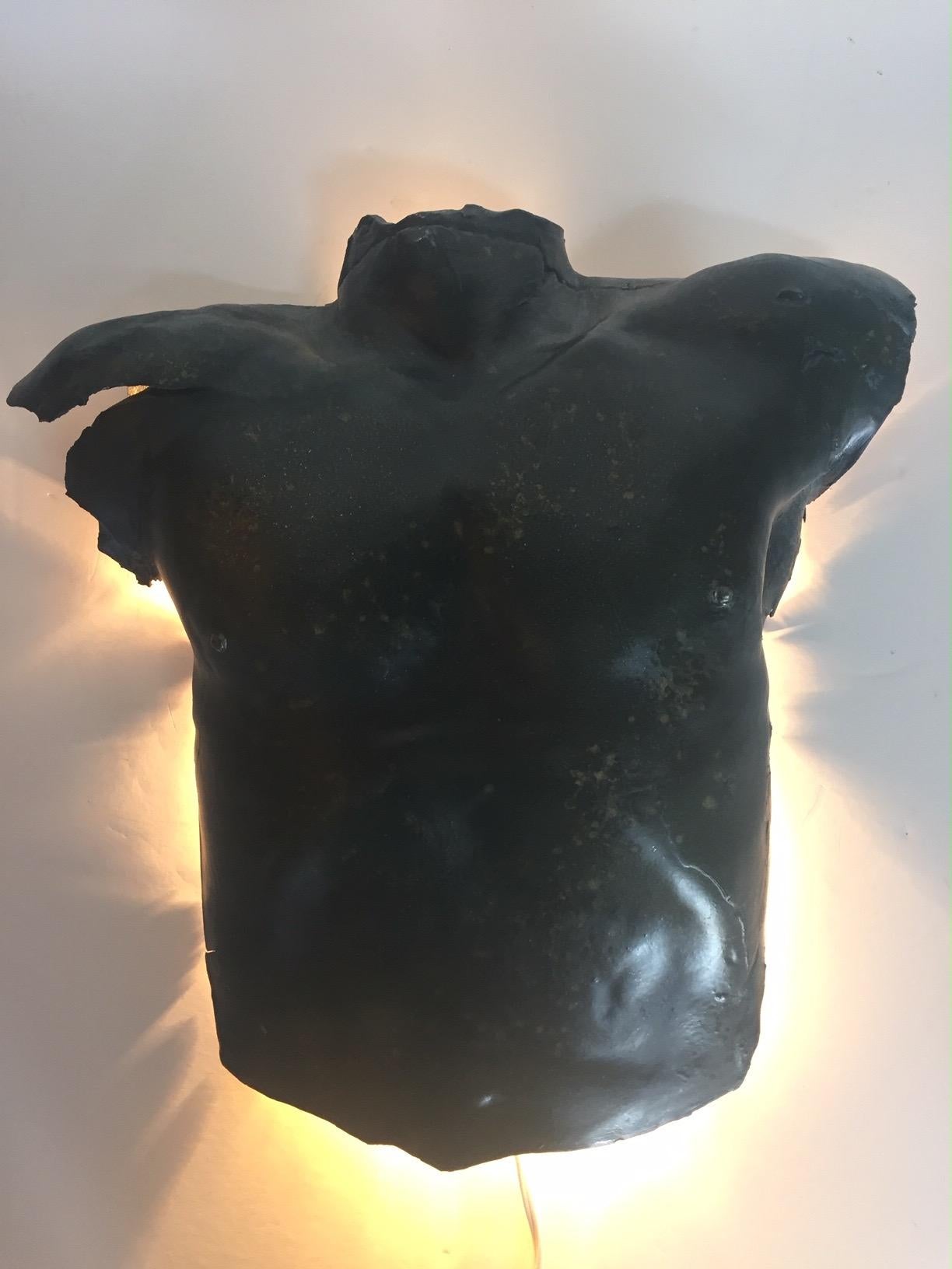 male torso wall sculpture