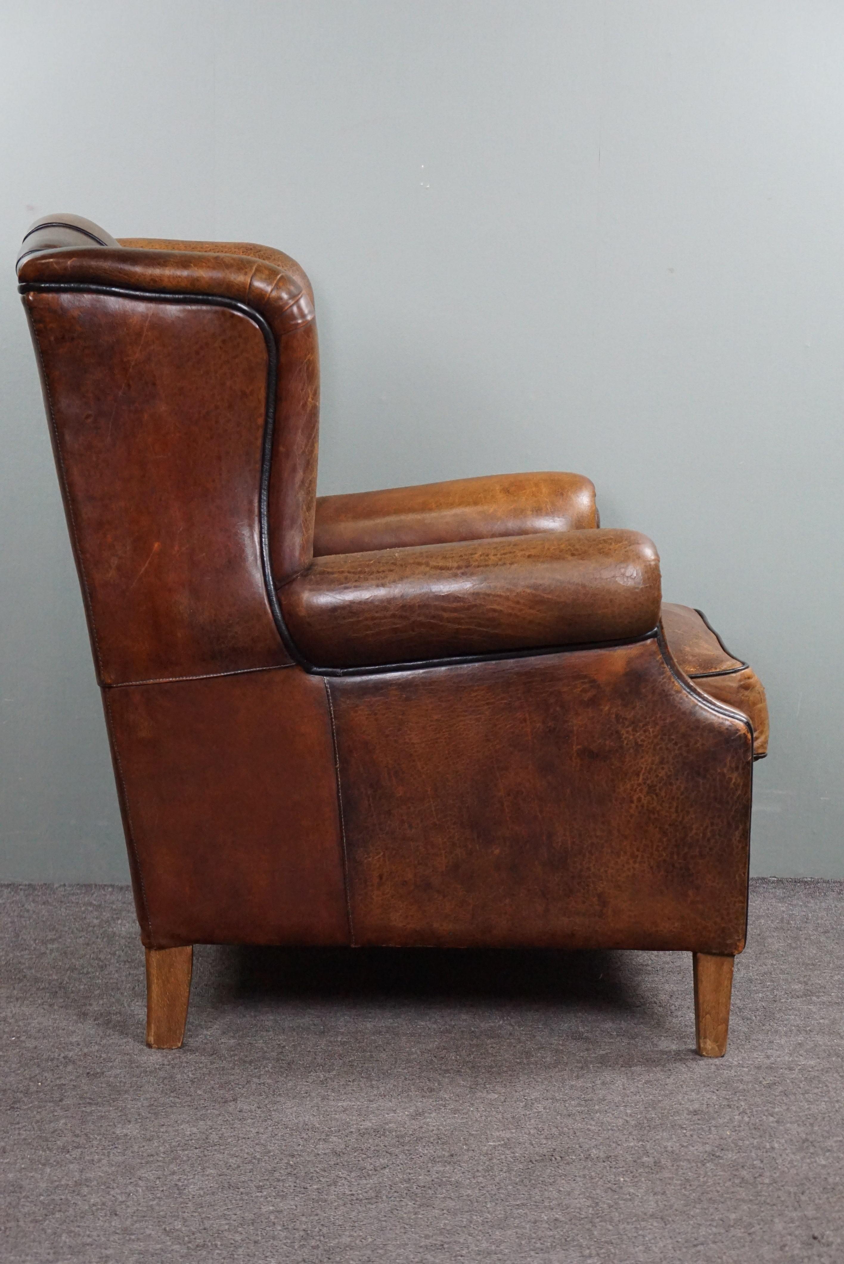 Strikingly colored sheepskin leather wing chair In Distressed Condition For Sale In Harderwijk, NL