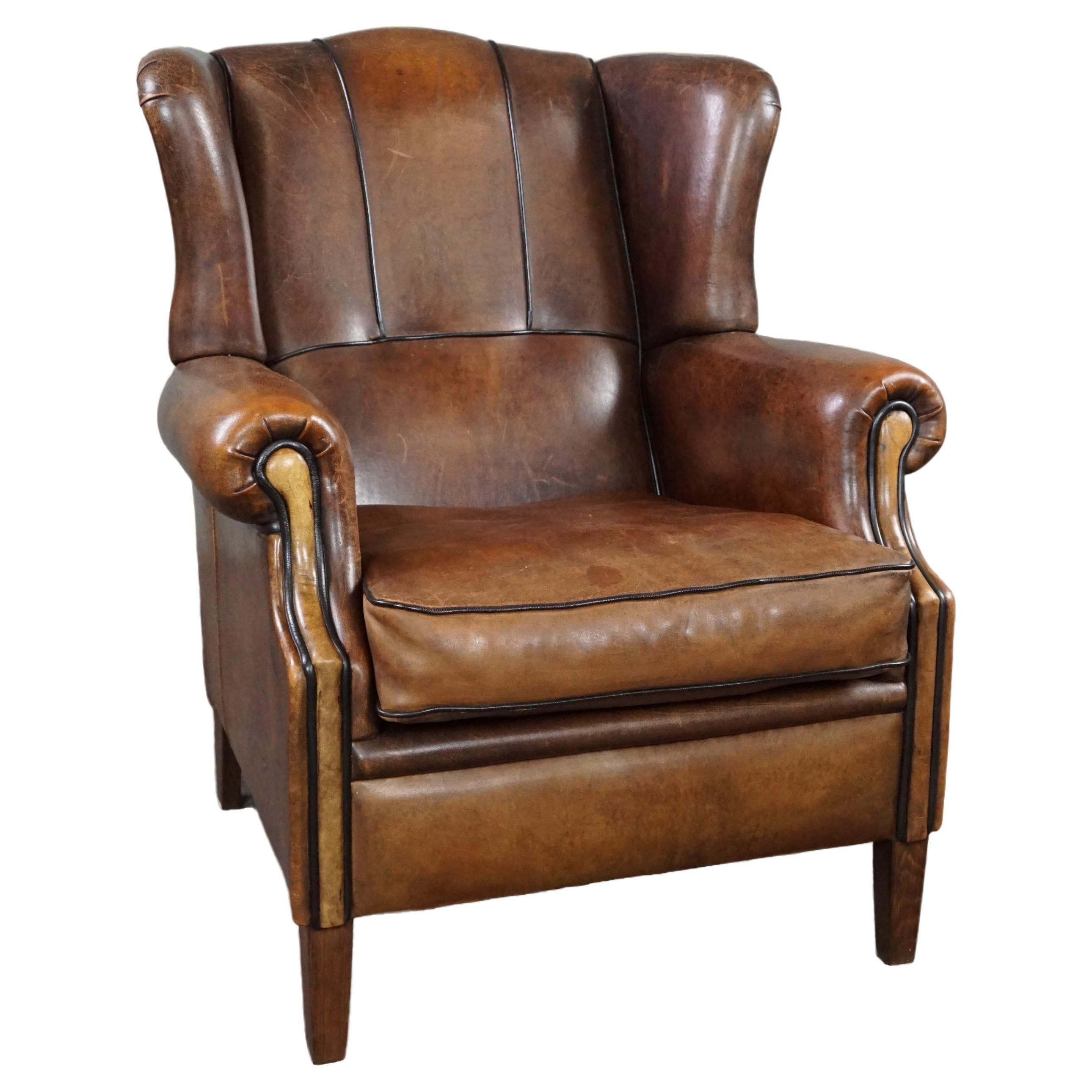 Strikingly colored sheepskin leather wing chair For Sale