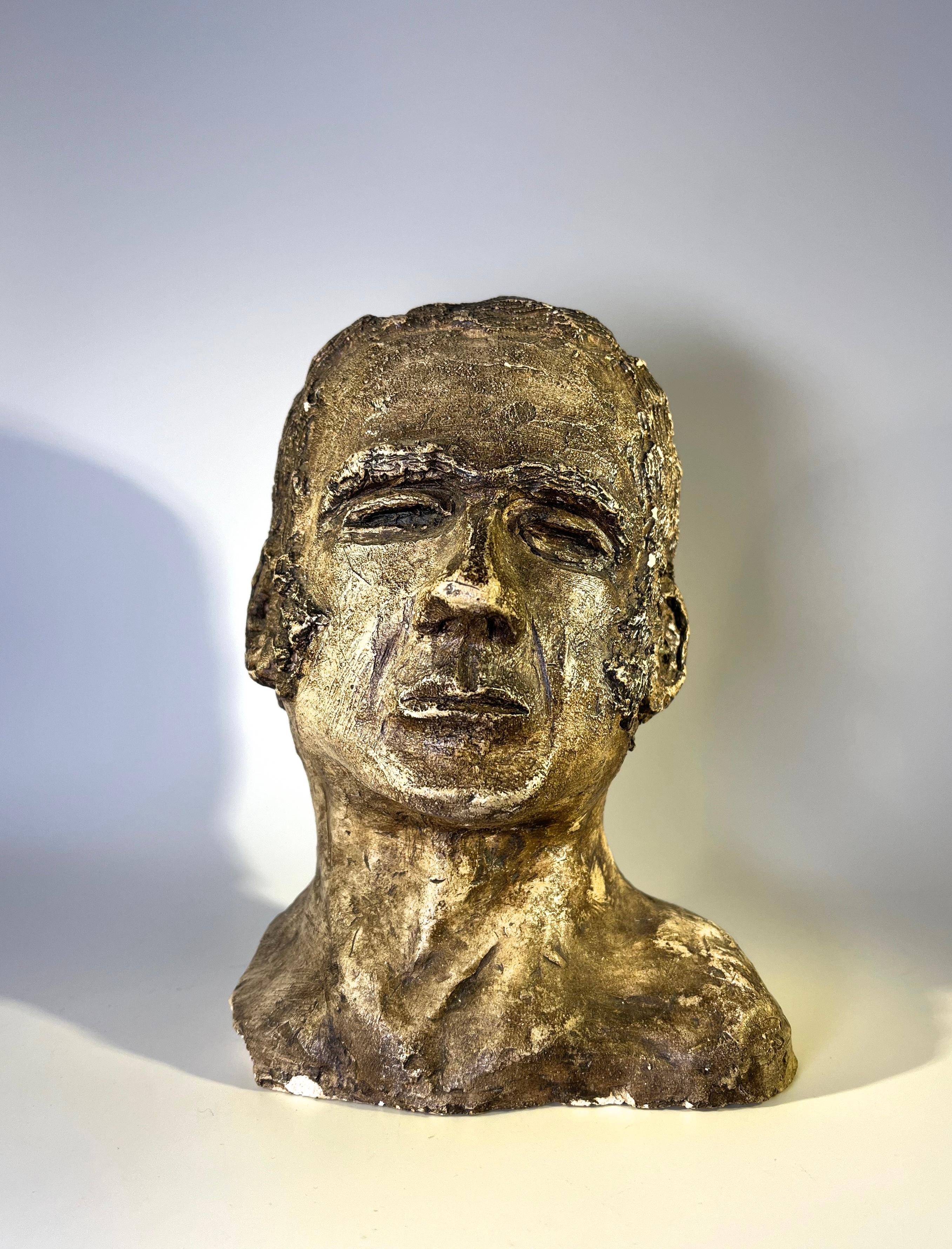 Mid 20th century hand sculpted clay bust of a Peruvian male
The intense expression and rough texture accentuate the machismo of this piece
A portion of one shoulder is missing, however, this in no way detracts from the potency of this wonderful