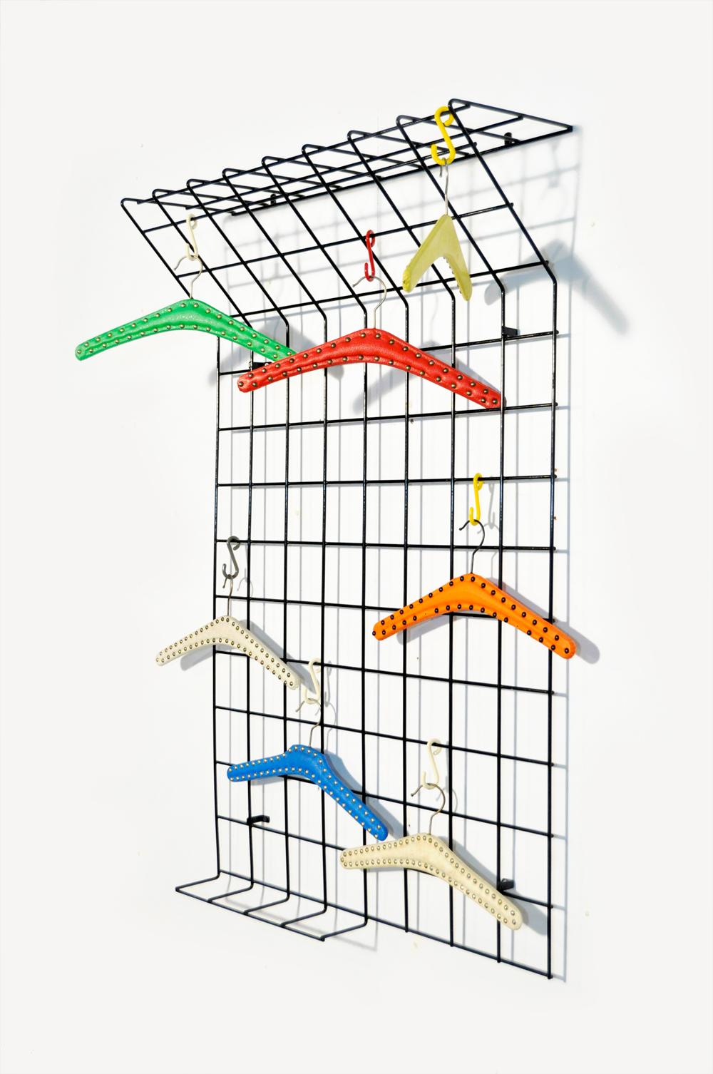 Metal wire wall coat rack designed by Karl Fichtel and produced by Drahtwerke Erlau AG Aalen, Germany 1950. Wall coat rack of black metal wire work with “hat shelf”, umbrella stand and colored plastic hooks/hangers (can be moved as desired). The