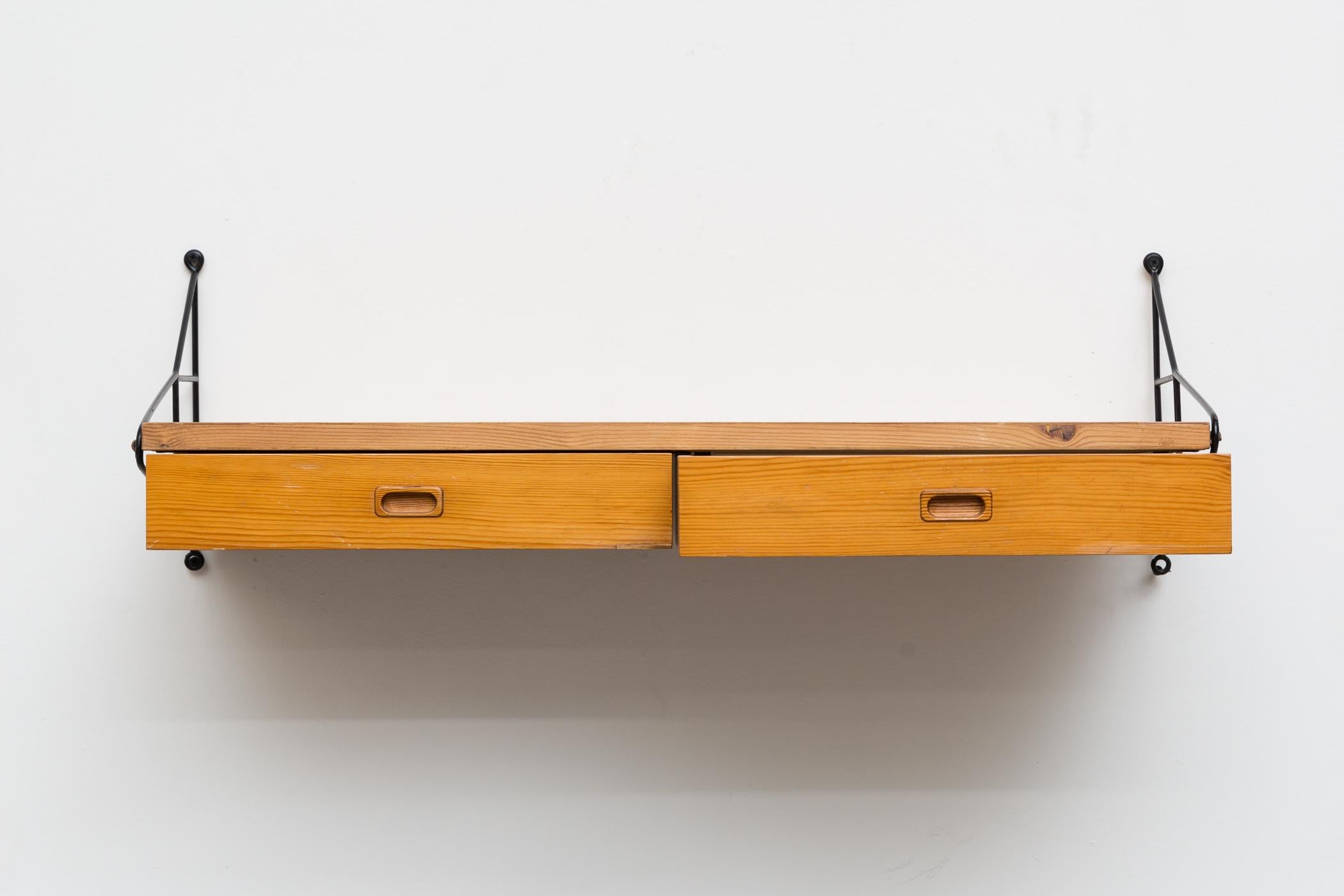 Mid-Century Pine Wall Mount Shelf. Lightly Refinished. Two Drawers with Oval Carved Hand Pulls. Designed for String in the .