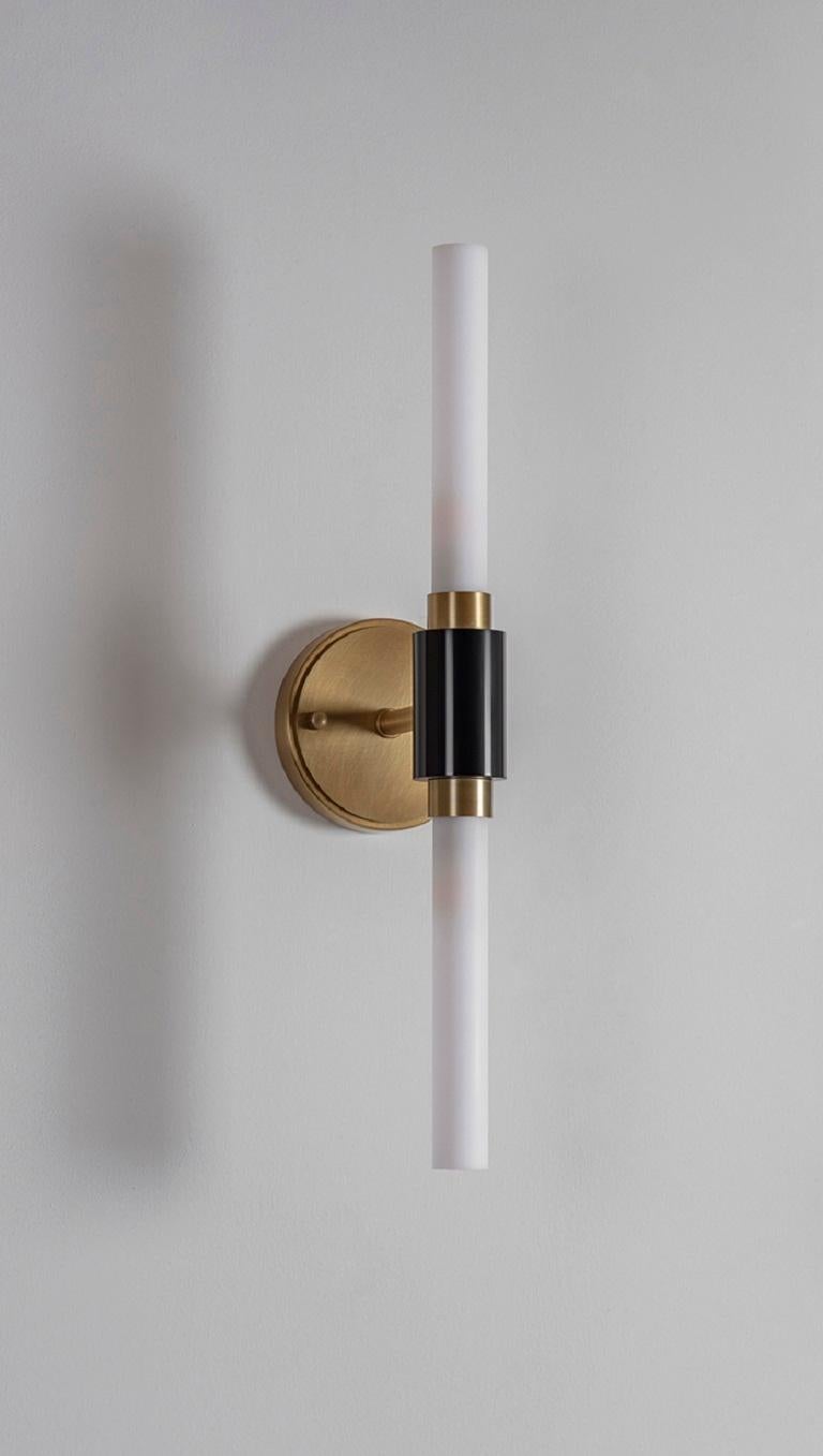 Strip wall lamp by Square in Circle, 2022
Dimensions: H 55 cm
Projection: 12.5 cm
Materials: brushed brass, glass tube, black marble

This simple yet striking wall light is inspired by the 1920s “Slat” ballet by Bauhaus artist Oskar Schlemmer.
