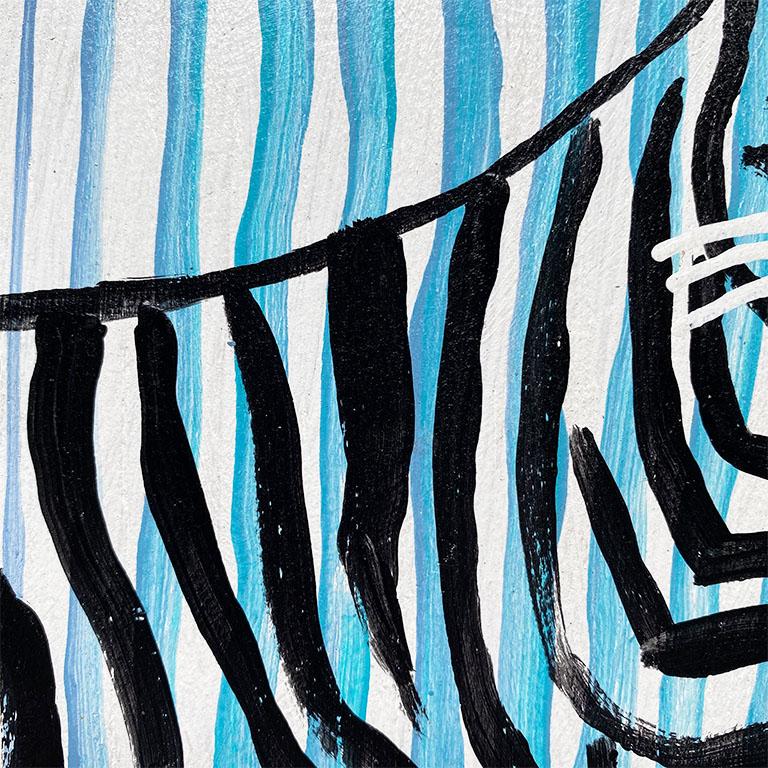 A gorgeous painting of a tiger in blue and black. This piece features the outline of a tiger in black, on blue and white stripe background. This piece is painted on wood and is ready to hang with a hanging wire on the back.

Dimensions:
11