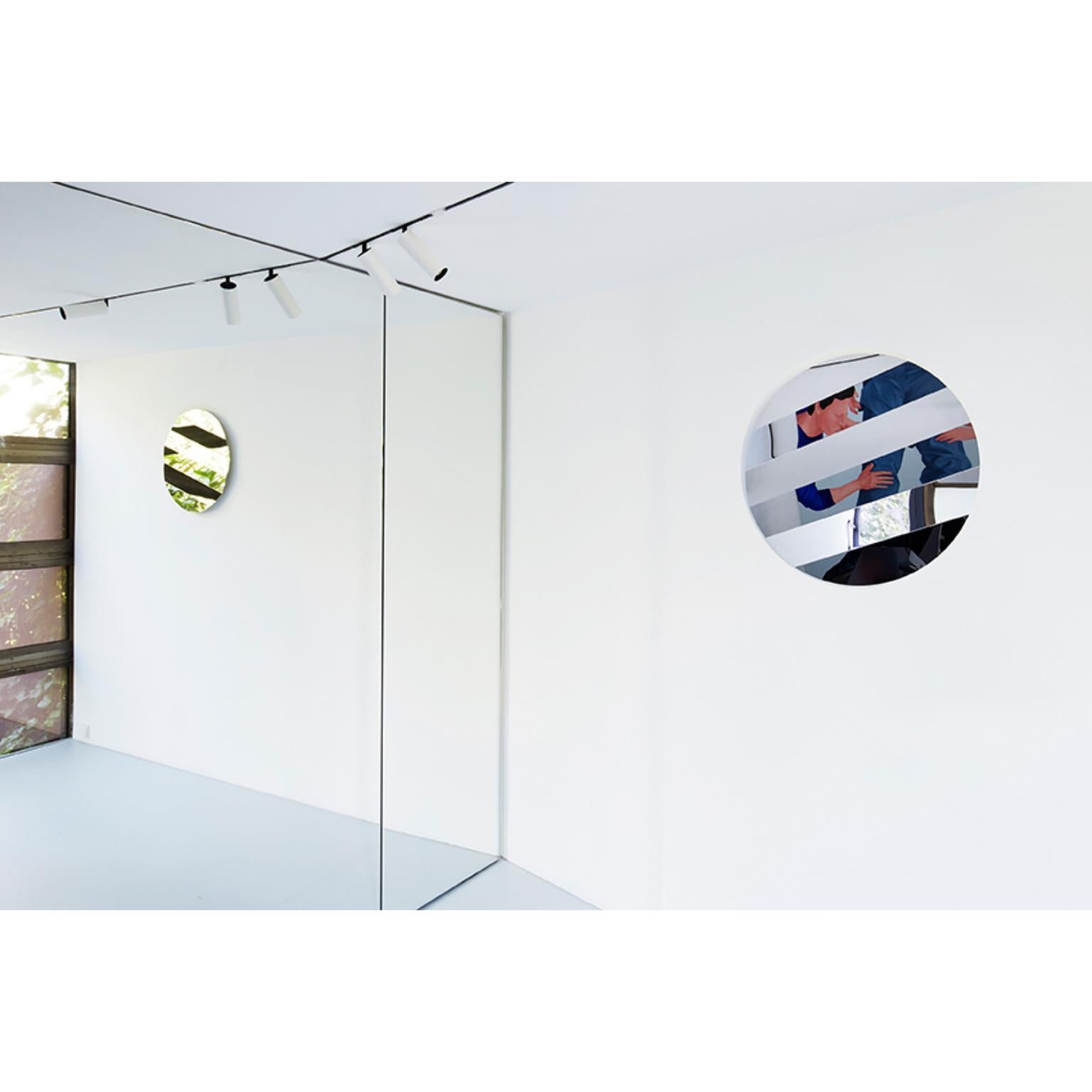 Stripe Mirror 120 Circle by Sebastian Scherer.
Dimensions: ø : 120. 
Materials: Mirror Stainless Steel, Wooden Bracket
Different sizes are available. Square version available.

The STRIPE wall mirror creates a fascinating graphic effect: the