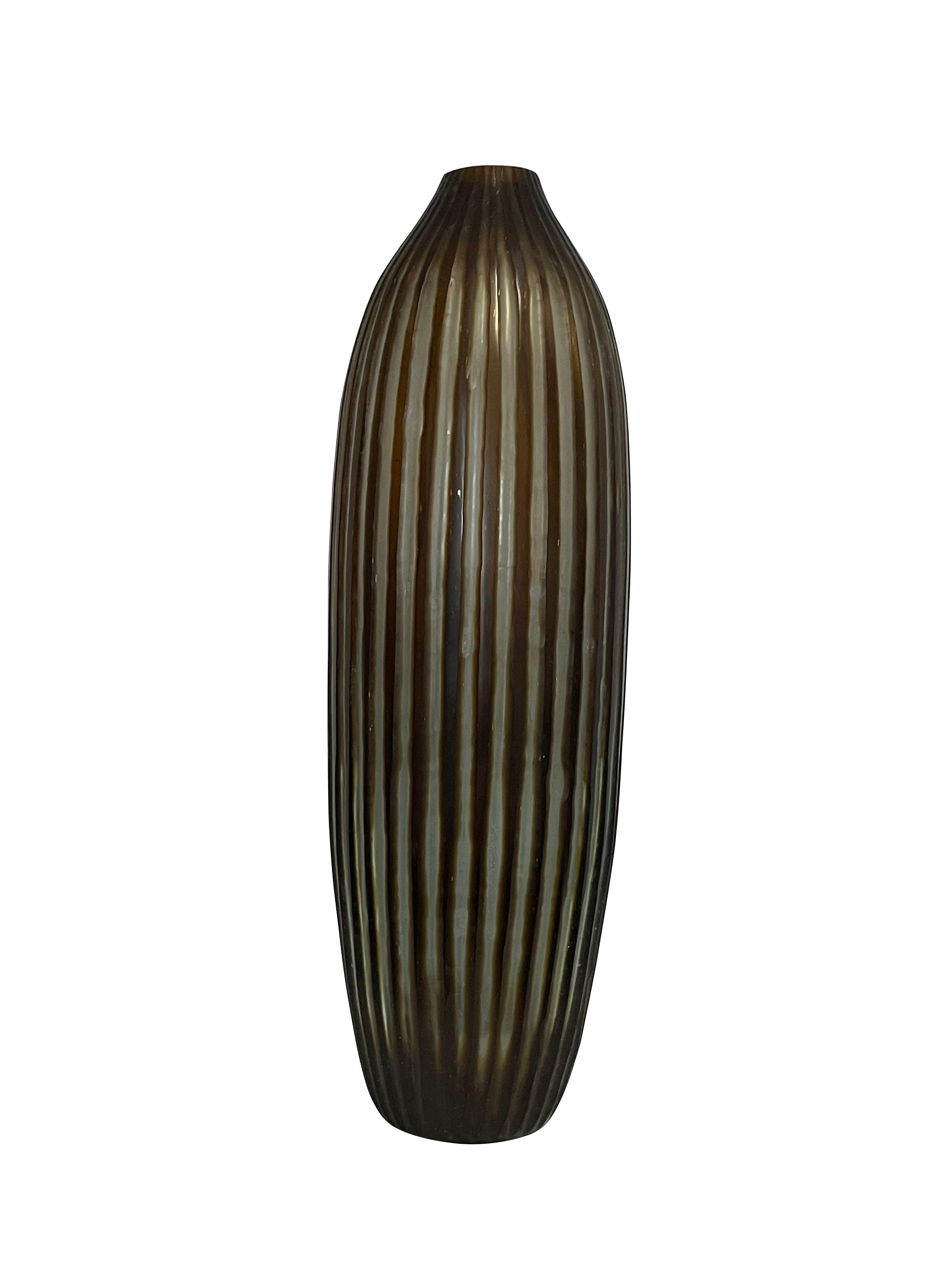 Contemporary Romanian vertically ribbed and striped brown glass vase.
Tall cylinder shape with a narrow curve at the top.
Sits well with shorter version S6115.