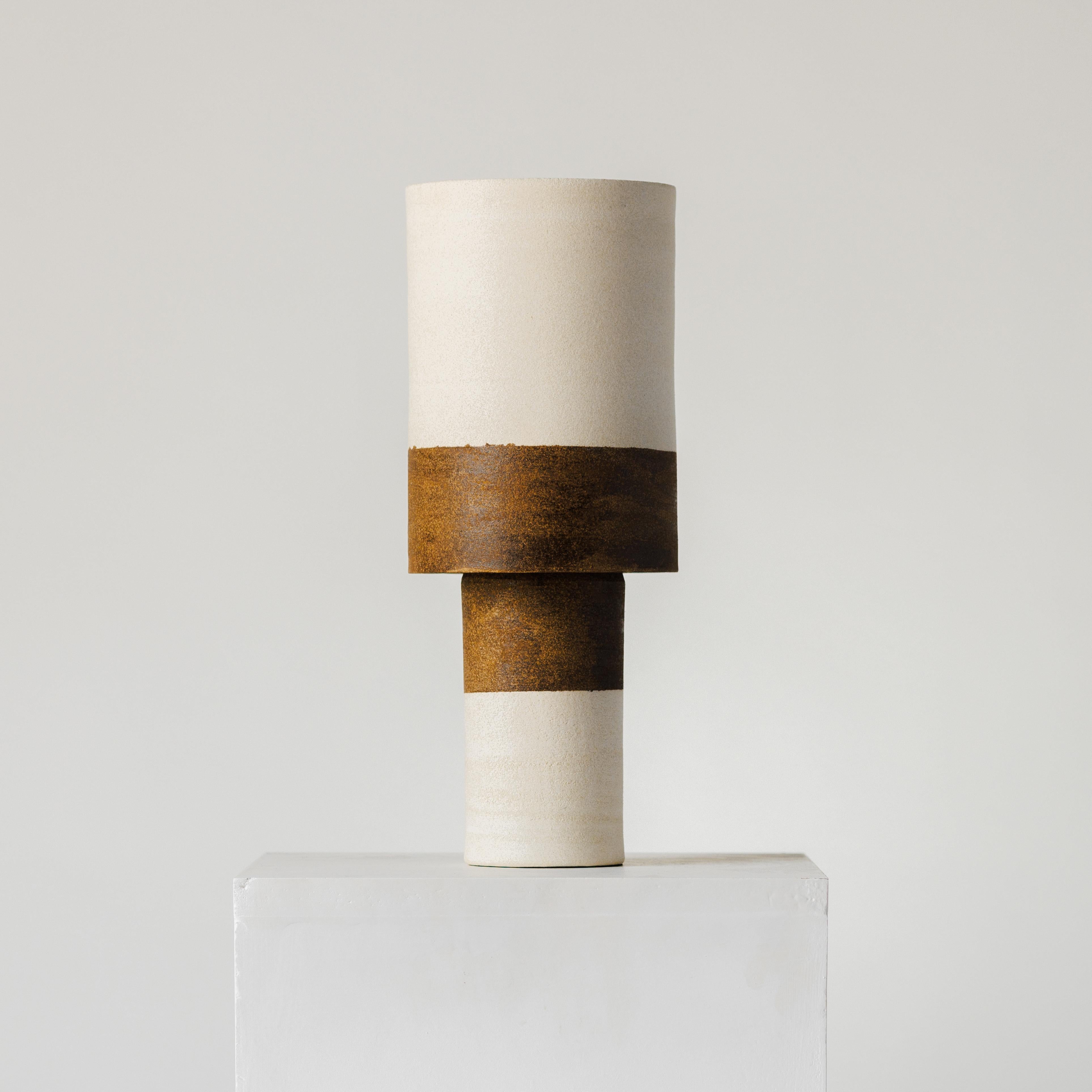 It starts off with 1kg of clay for both the top and bottom of the lamp. Thrown on the potters wheel they are left to dry overnight and trimmed, smoothed and fitted together the next day. It's during this process that the fit is adjusted and the