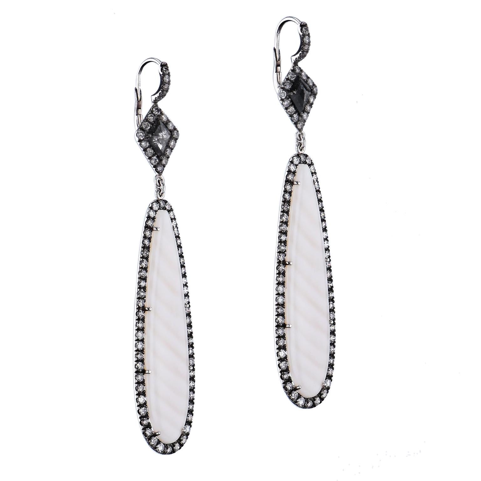 Handmade 18kt White gold earrings with striped Chalcedony drops from Madagascar.  Adorning the top are 2 Natural Black Diamonds with a total weight of 0.97ct and tying it all together there are 3 carats of black galaxy and white diamonds pave set