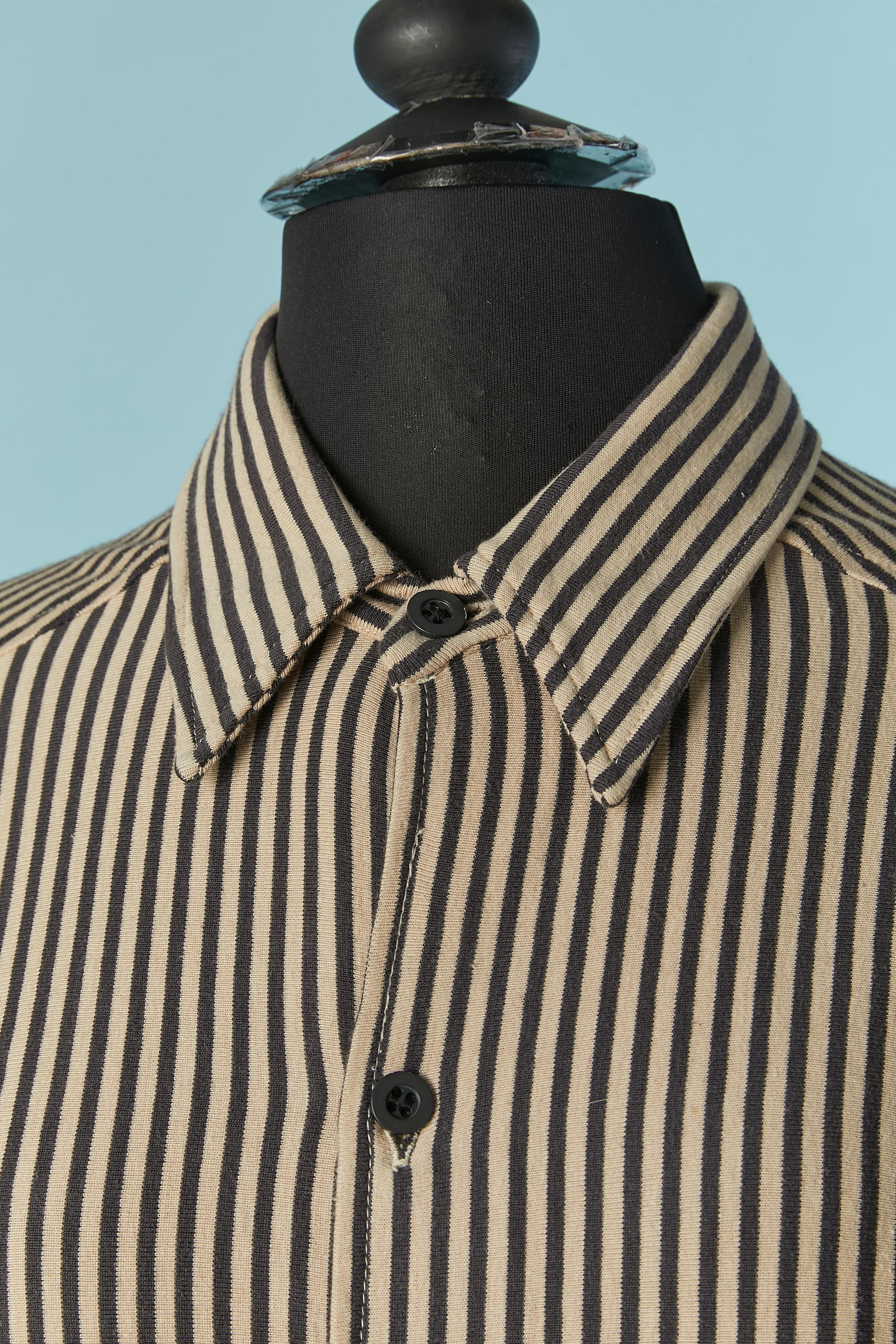 Striped cotton jersey shirt. Button and buttonhole closure on the middle front and on the cuffs. 
SIZE L on tag but fit more likely M ( Men size) 