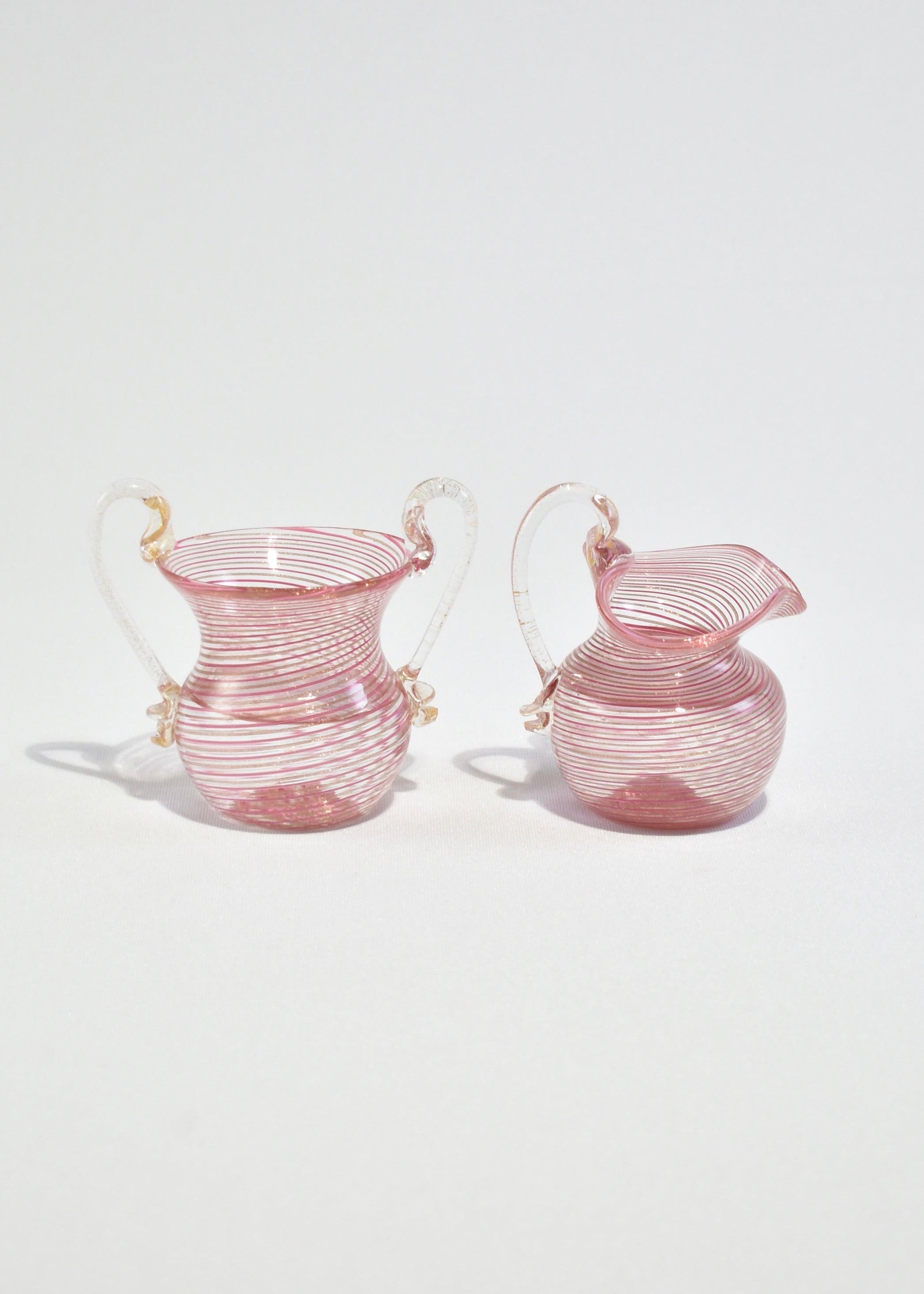 Beautiful vintage blown glass cream and sugar set with pink stripe and gold fleck detail. Made in Italy.
